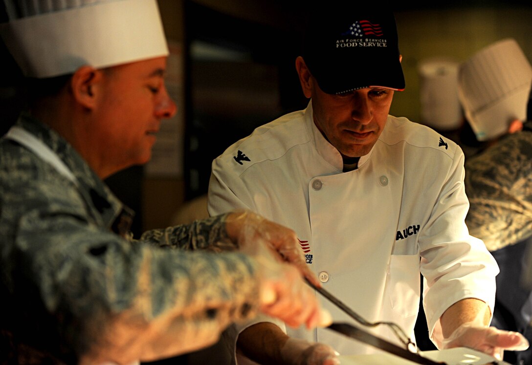 Col. Korvin Auch, 633rd Air Base Wing commander, receives a slice of roast at the Langley Air Force Base dining facility, Nov. 22, 2012. Auch spent part of his Thanksgiving providing Joint Base Langley-Eustis Service members and their families a traditional holiday meal. (U.S. Air Force photo by Senior Airman Jarad A. Denton/Released)