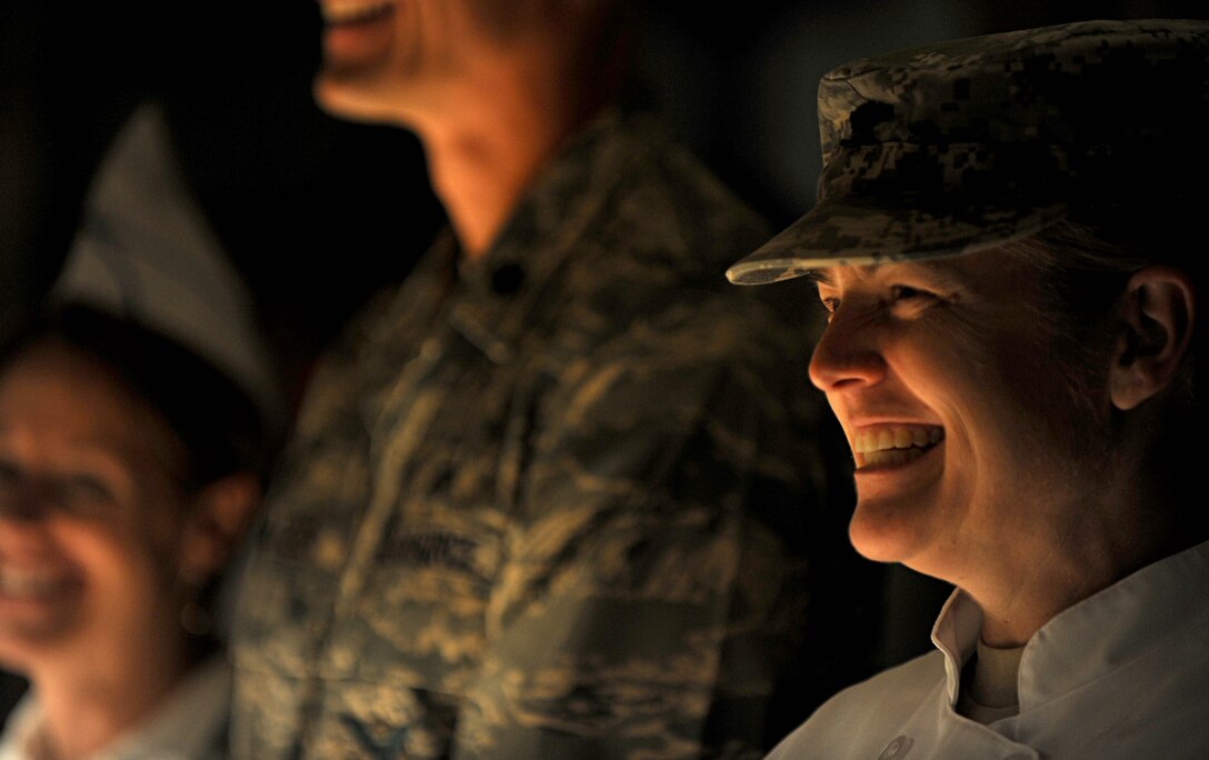 U.S. Army Col. Jayne Jansen, 633rd Air Base Wing vice commander, smiles while serving patrons of the Langley Air Force Base, Va. dining facility, Nov. 22, 2012. Jansen joined base leadership and served a traditional Thanksgiving dinner to Service members and their families. (U.S. Air Force photo  by Senior Airman Jarad A. Denton/Released)