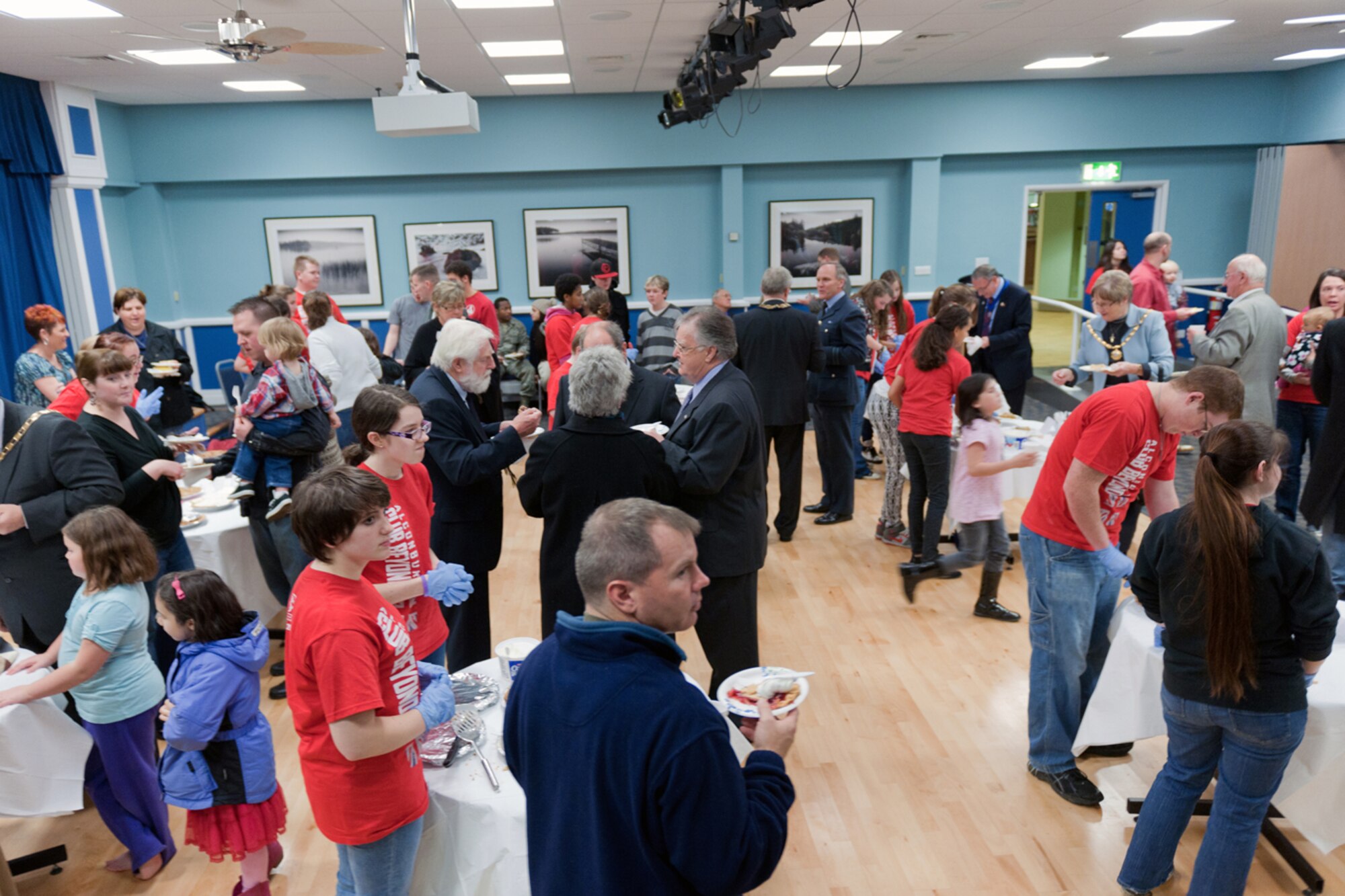 RAF ALCONBURY, United Kingdom – Members of the 501st Combat Support Wing and local communities eat pie during the Thanksgiving Pie Social at the Community Activity Center Nov. 21. The RAF Alconbury Chapel hosted the social and the women of the chapel baked more than 80 pies for the event. (U.S. Air Force photo by Staff Sgt. Brian Stives)