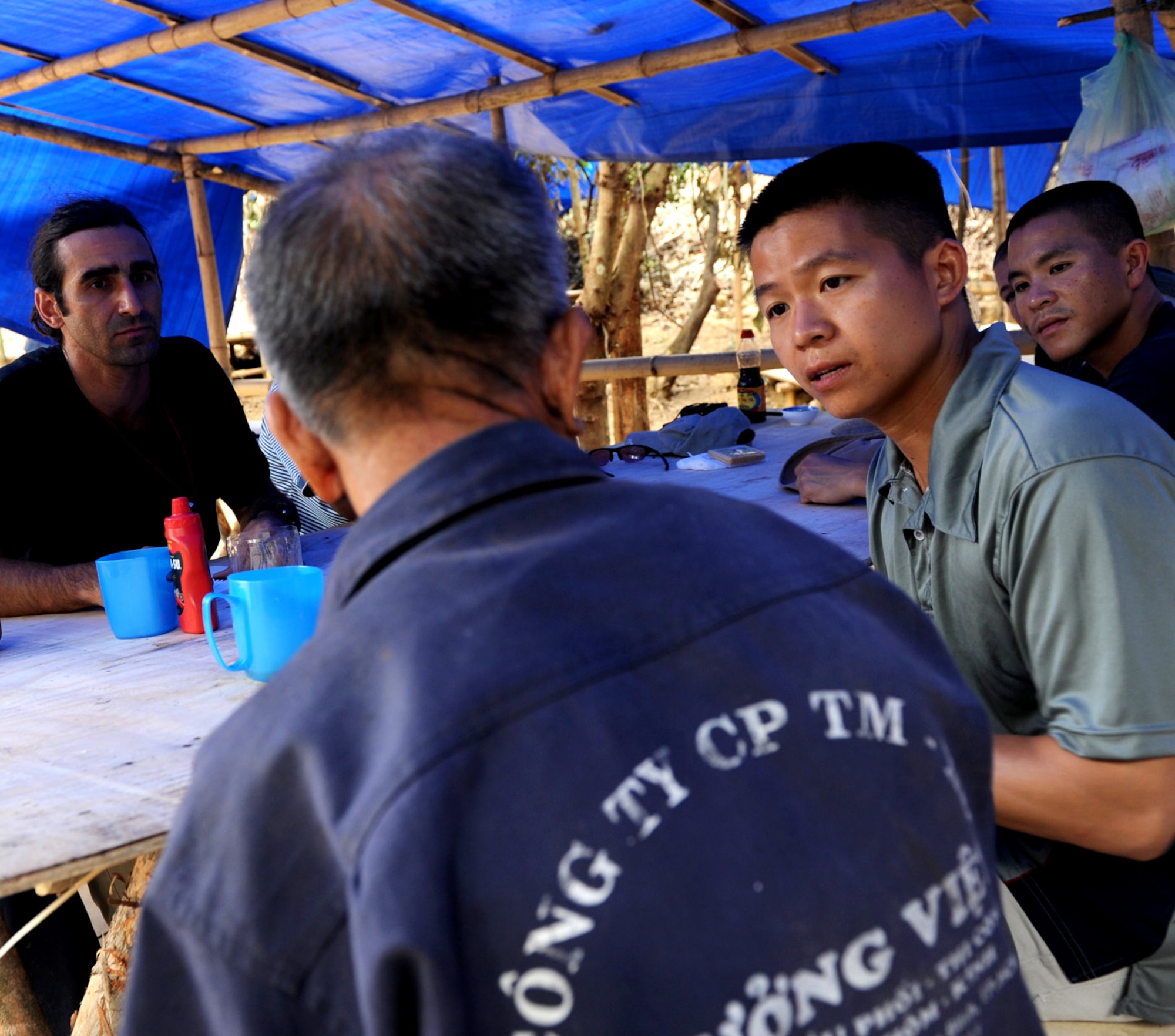 Capt. Huy Tran, an officer stationed at Grand Forks AFB, N.D., interviews a witness in Vietnam during a search and recovery mission in the summer of 2012. In cooperation with the Joint Prisoners of War/Missing in Action Accounting Command, (JPAC), and the Language Enabled Airman Program (LEAP), Tran played a vital role as a Vietnamese linguist on a recovery mission to bring home service members missing from the Vietnam War Era. (Courtesy photo)