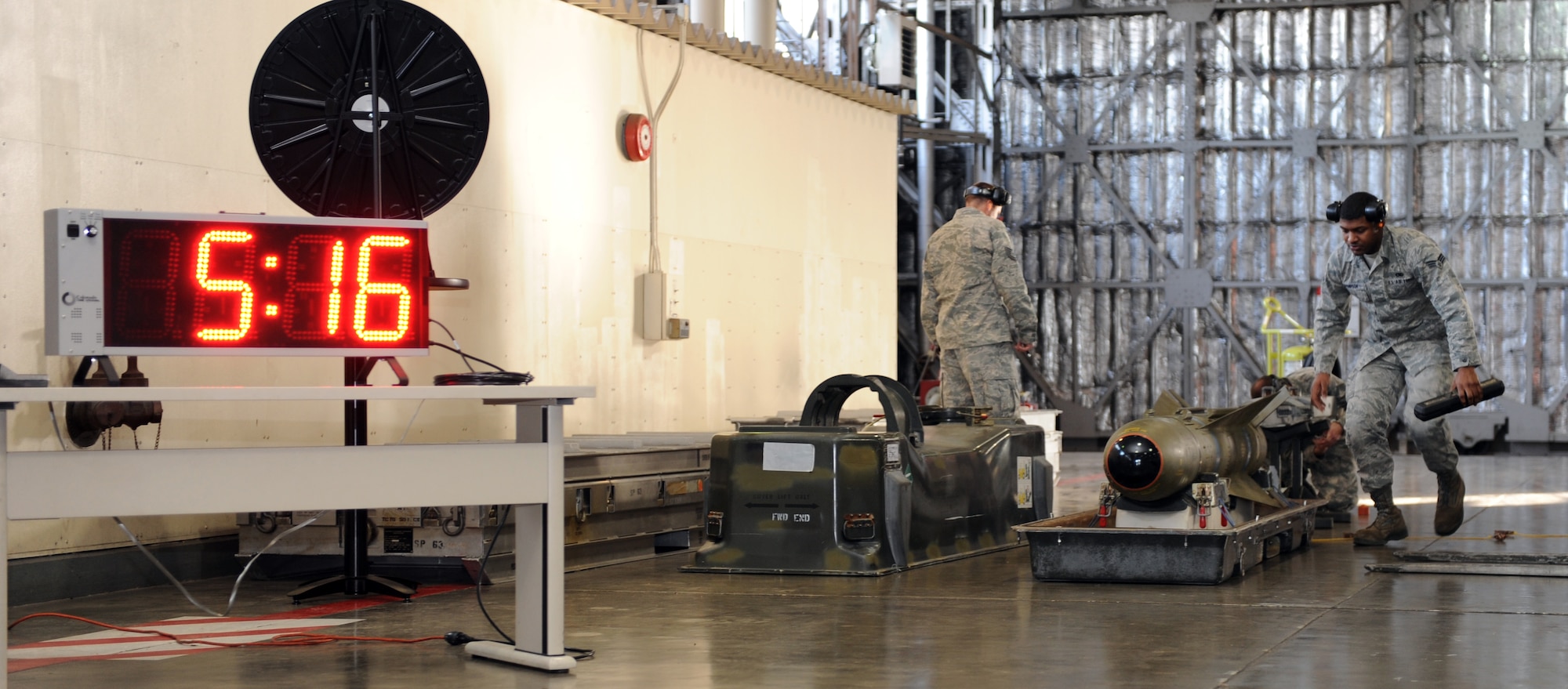 U.S. Air Force Airmen from the 13th Aircraft Maintenance Unit ready an AGM-65 missile for lifting during the 35th Fighter Wing Load Crew of the Year Competition at Misawa Air Base, Japan, Nov. 21, 2012. Weapons Standardization evaluators chose the winning team by compiling a total score from inspections, a weapons subject matter test, load times and the number of discrepancies found during the load. After the scores were compared, the 13 AMU load crew stood out as the winners of this year’s competition. (U.S. Air Force photo by Airman 1st Class Kia Atkins)