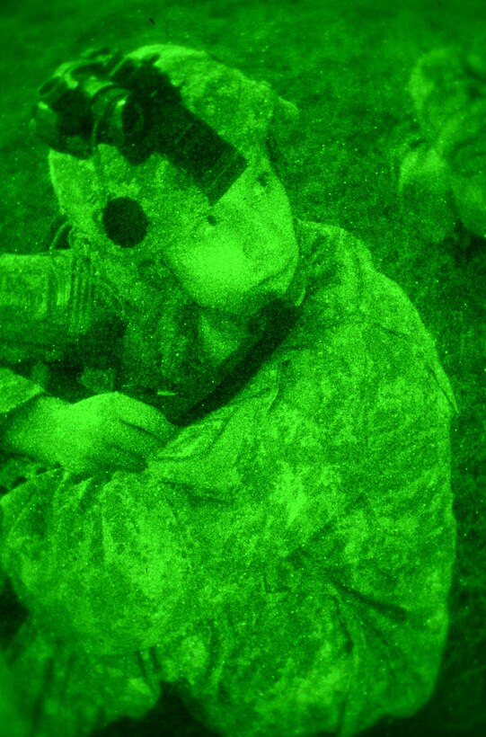 Army Spc. Sean Locke establishes communications with the Fort Bragg Operations Center during an assault command post exercise on Pope Army Airfield, N.C., Nov. 15, 2012. U.S. Army photo by Sgt. Katryn Tuton 