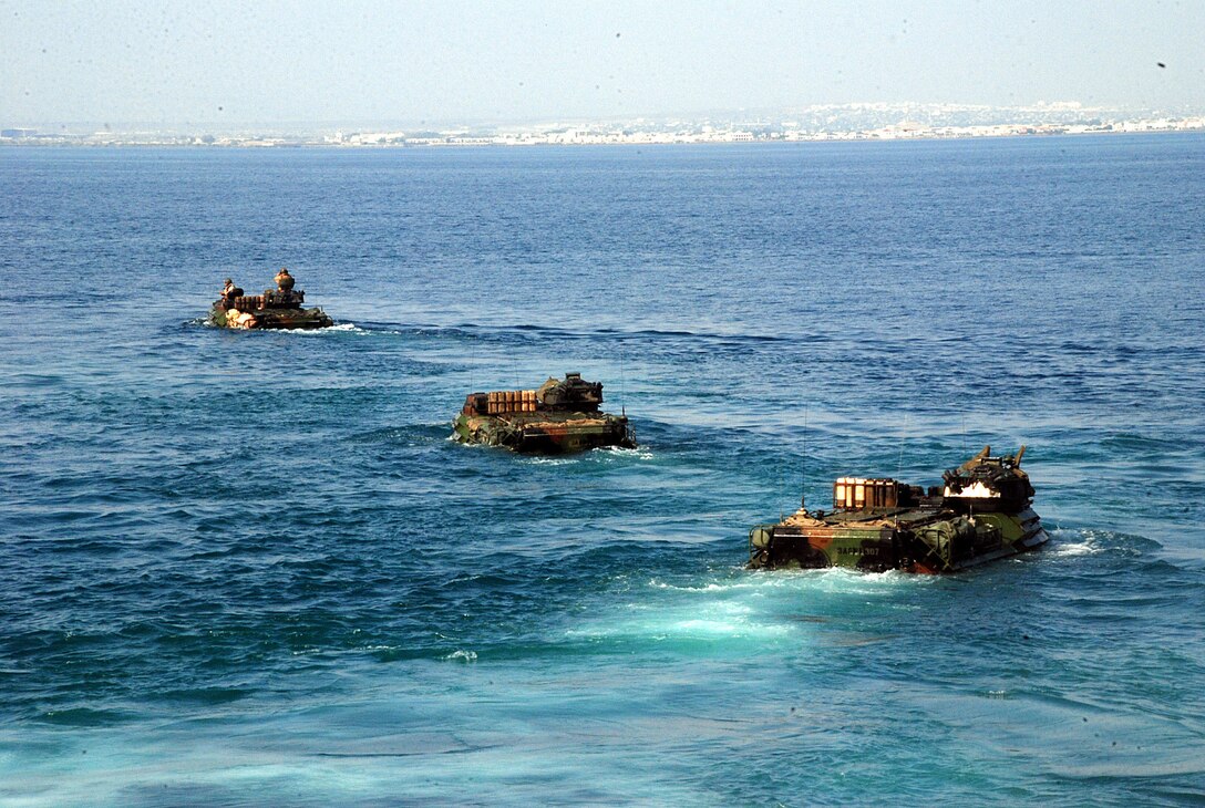 Amphibious assault vehicles (AAV) transit to shore after departing amphibious transport dock ship USS Green Bay (LPD 20) during a routine well deck training exercise. Green Bay is part of the Peleliu Amphibious Ready Group, with the embarked 15th Marine Expeditionary Unit, and is deployed in support of maritime security operations and theater security cooperation efforts in the U.S. 5th Fleet area of responsibility. (U.S. Navy Photo by Mass Communication Specialist 1st Class (SW/AW) Elizabeth Merriam)