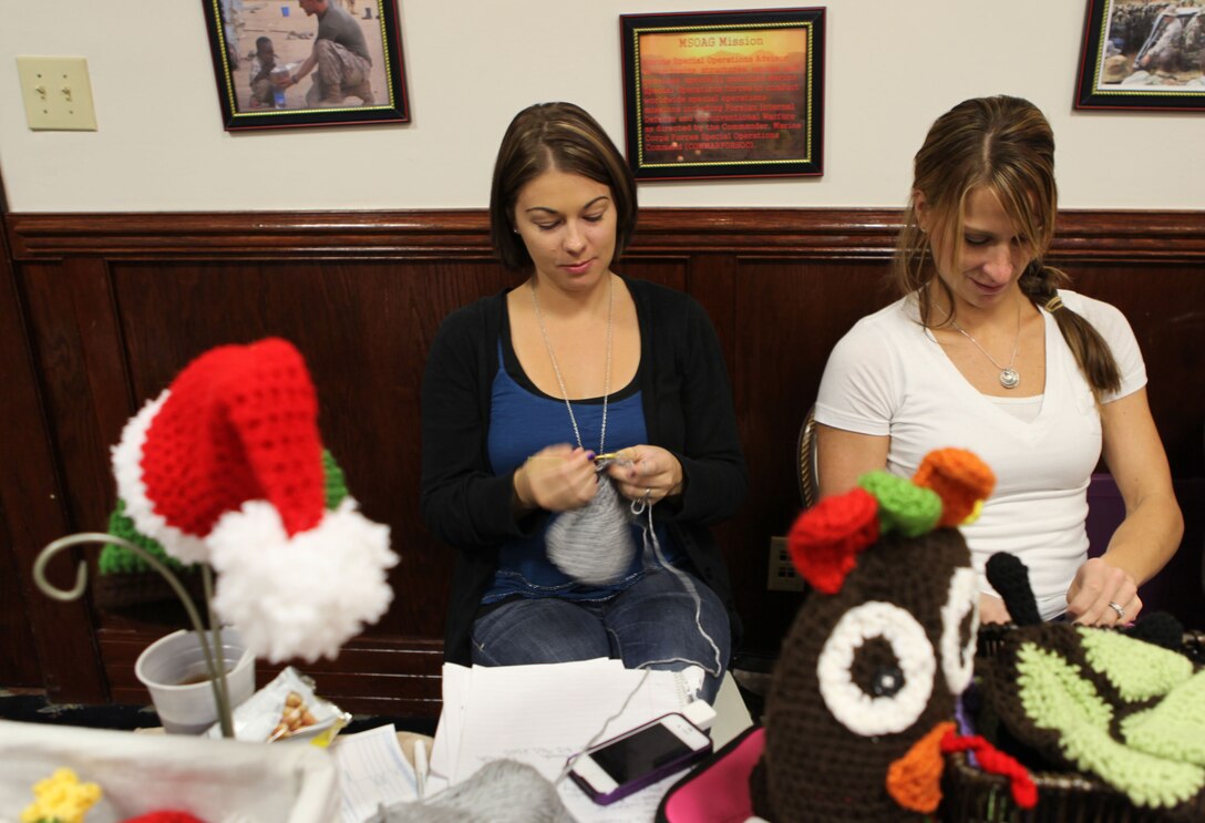 Women knit a booth at the Hidden Talents Fall Craft Fair aboard Marine Corps Base Camp Lejeune Nov. 17. The fair specialized in goods handcrafted by members of the military community.  