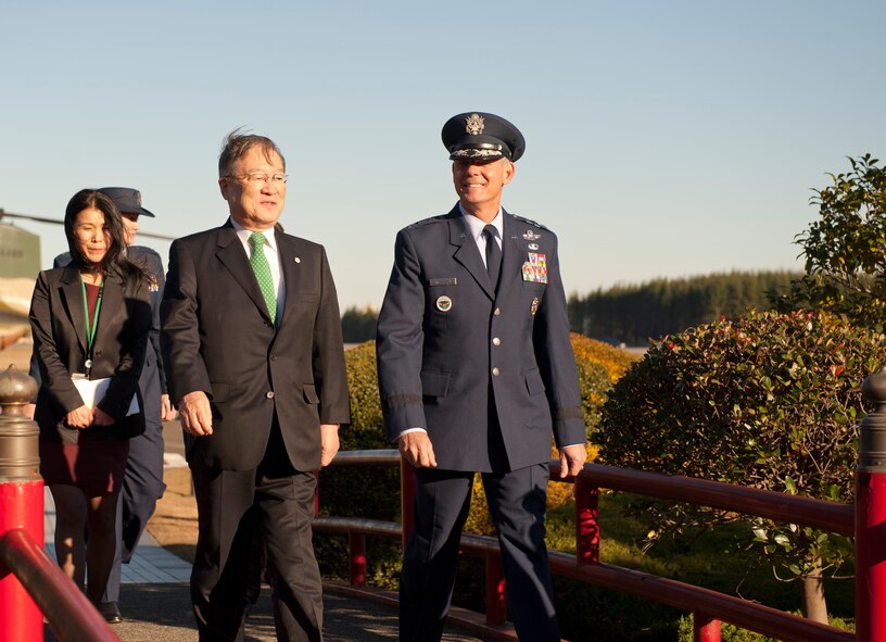 YOKOTA AIR BASE, Japan -- Japanese Defense Minister Satoshi Morimoto, center left, and Lt. Gen. Sam Angelella, U.S. Forces, Japan, and 5th Air Force commander, walk across the distinguished visitor garden at Yokota Air Base, Japan, Nov. 27, 2012. International media organizations covered Morimoto's visit to the Japanese Air Defense Command headquarters recently relocated to Yokota. (U.S. Photo/ Airman 1st Class Krystal M. Garrett) 