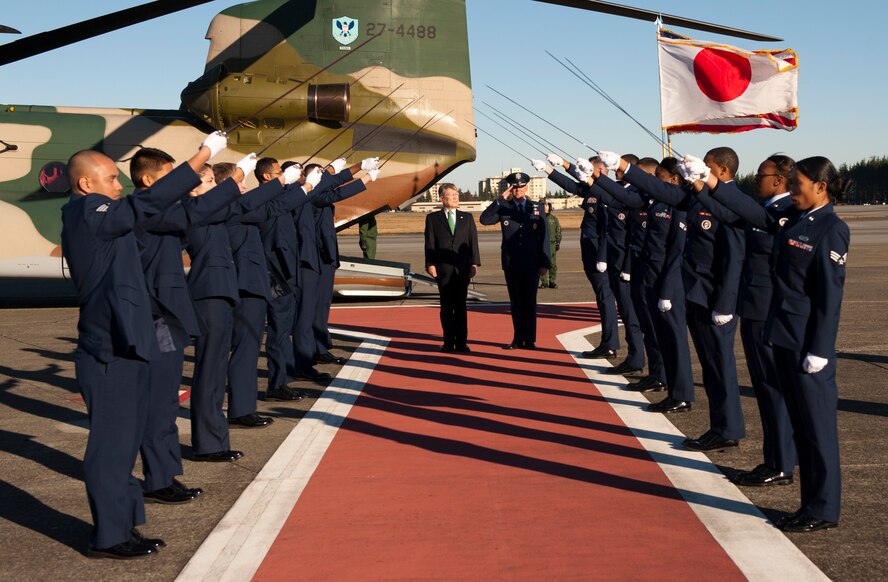YOKOTA AIR BASE, Japan -- Japanese Defense Minister Satoshi Morimoto, left, and Lt. Gen. Sam Angelella, U.S. Forces, Japan, and 5th Air Force commander, walk through a saber cordon at Yokota Air Base, Japan, Nov. 27, 2012. The Yokota Air Base Honor Guard organized the saber cordon to formally welcome Morimoto. (U.S. Air Force photo by Airman 1st Class Krystal M. Garrett) 