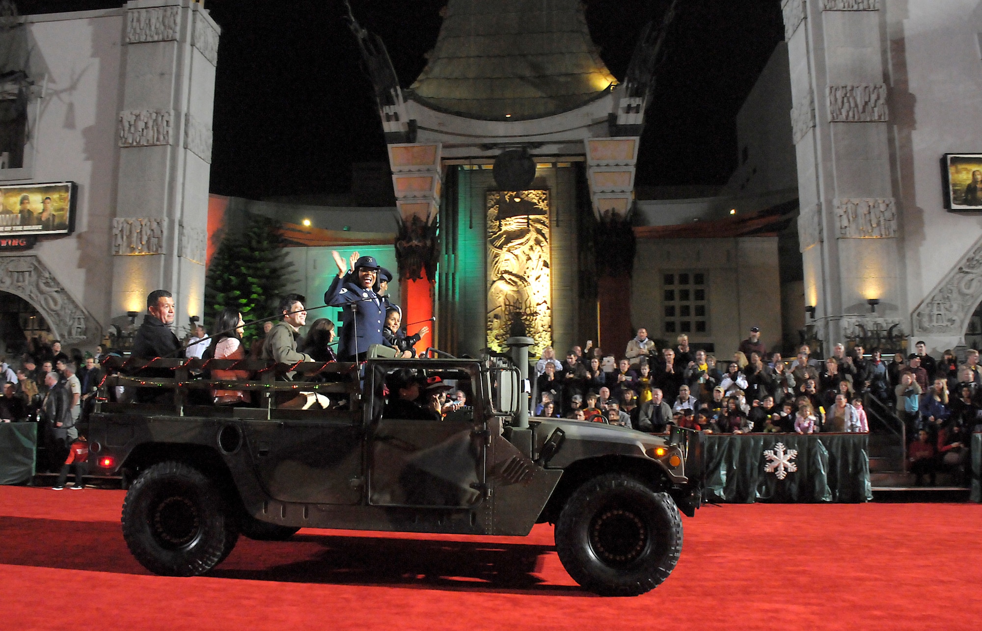 SMC Command Chief Master Sergeant Carol Dockery is joined by other Air Force members and children from Children’s Hospital Los Angeles riding on the red carpet during the Hollywood Christmas Parade, Nov. 25.  (Photo by Joe Juarez)