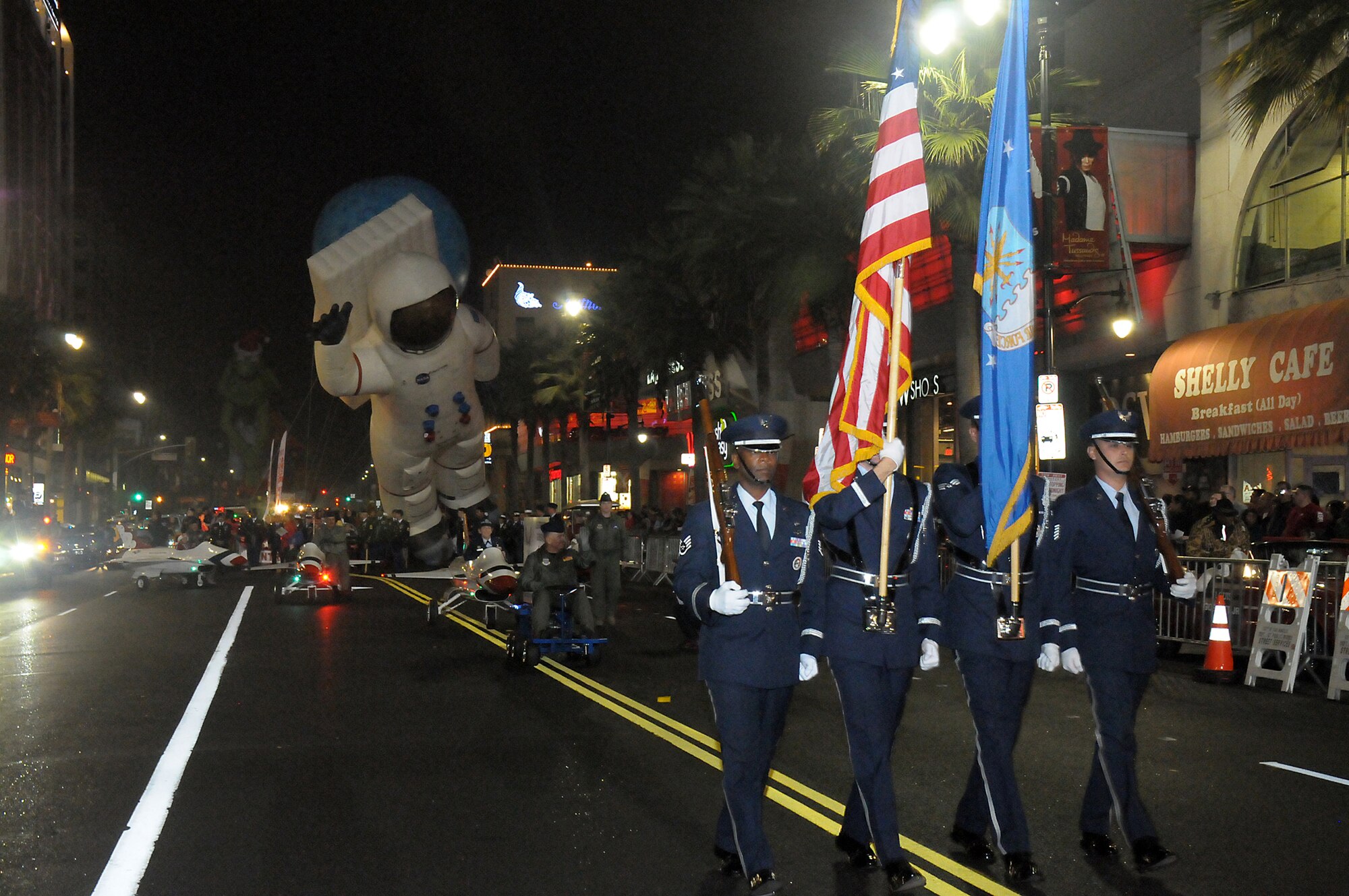 An Air Force honor guard from March Reserve Base heads up the Air Force members participating in the 81st annual Hollywood Christmas Parade, Nov. 25. (Photo by Joe Juarez)