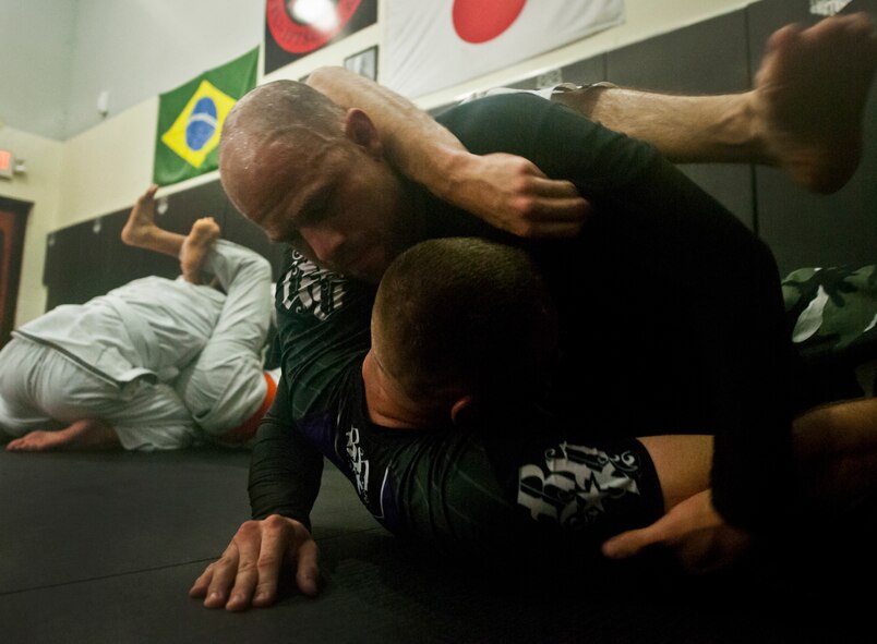 Staff Sgt. Danny Ruiz, a Reservist with the 919th Logistics Readiness Squadron, works on grappling techniques with other mixed martial arts fighters in preparation for Strike Fight, Eglin Air Force Base's first-ever mixed martial arts event Dec. 8.  Ruiz returns to fight at the base where he was stationed as a weapons loader while in the active-duty Air Force.  (U.S. Air Force photo/Tech. Sgt. Samuel King Jr.)