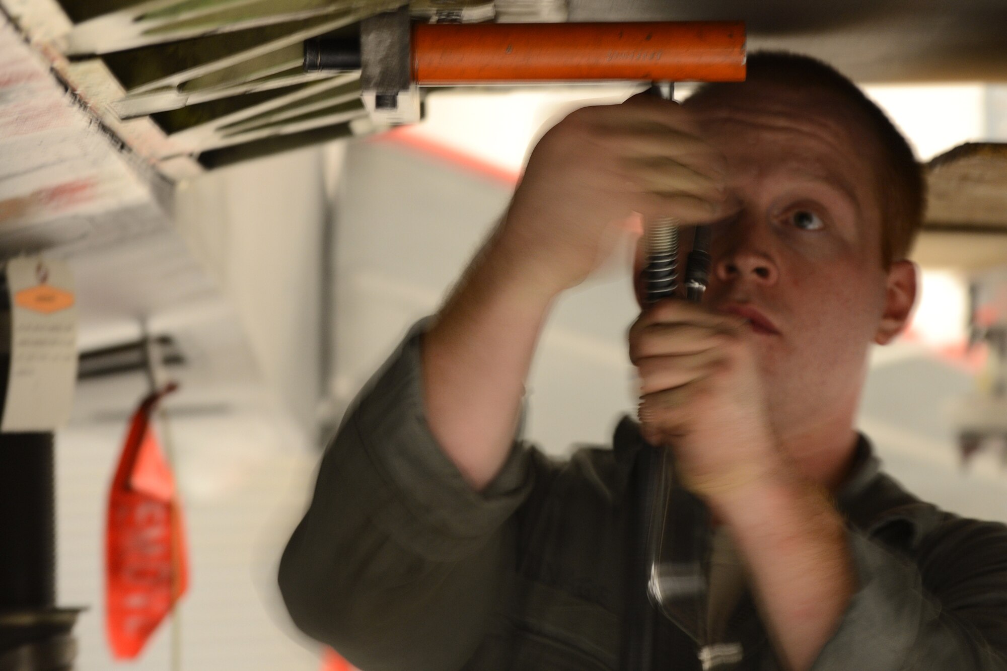 U.S. Air Force Senior Airman Phillip Turnage, 20th Maintenance Group fuels specialist, helps remove the wing on an F-16 Fighting Falcon at Shaw Air Force Base, S.C., Nov. 19, 2012. The wing was replaced due to an internal leak, which needed further maintenance.(U.S. Air Force photo by Airman Nicole Sikorski/Released)