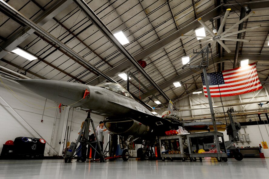 U.S. Air Force Airmen assigned to the 20th Maintenance Group prepare to remove a wing from an F-16 Fighting Falcon at Shaw Air Force Base, S.C., Nov. 19, 2012.  The wing was replaced due to an internal leak, which needed further maintenance.(U.S. Air Force photo by Airman Nicole Sikorski/Released)
