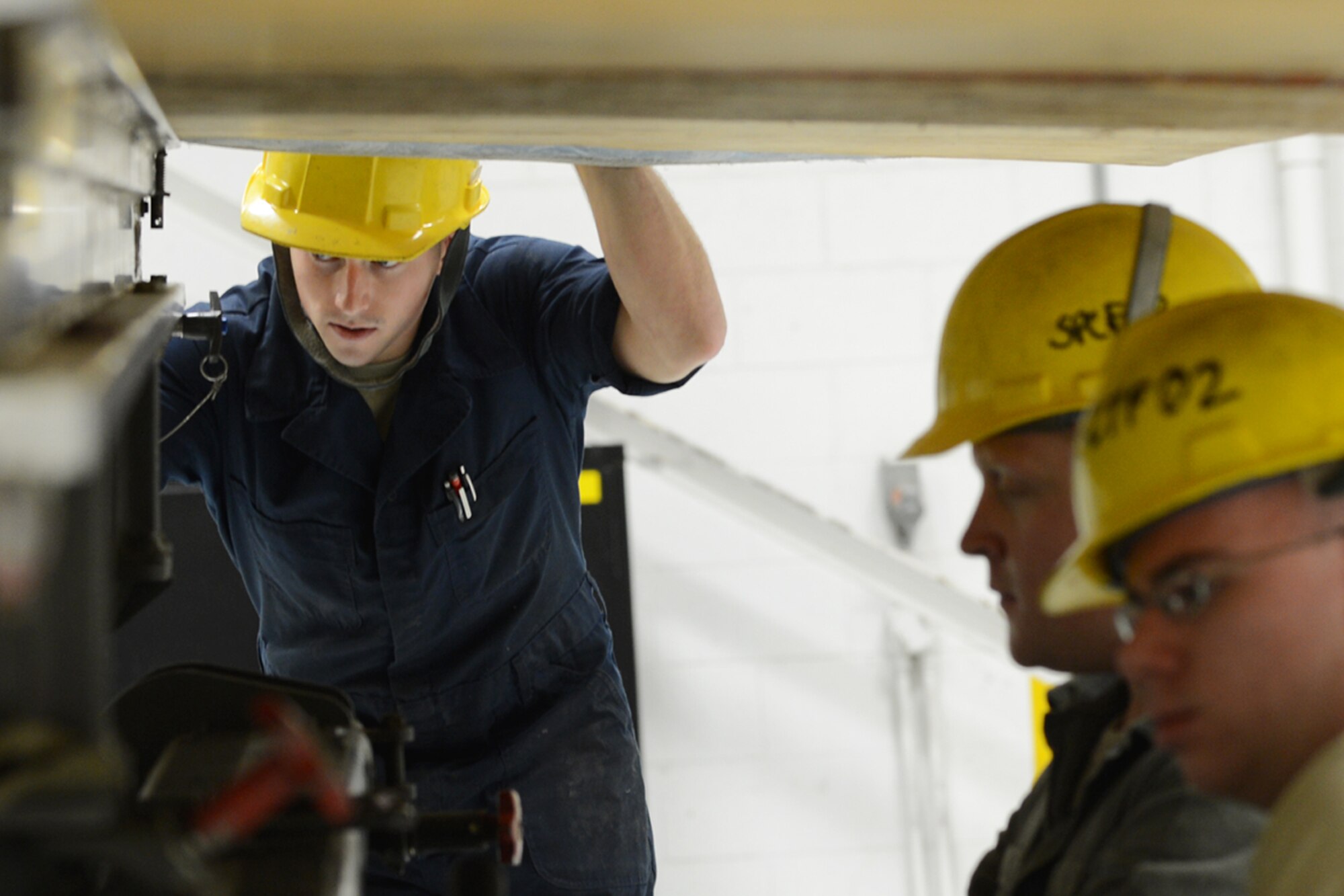 U.S. Air Force Airman 1st Class Kyle Jones, 20th Maintenance Group fuels specialist, repositions a wing that was removed from an F-16 Fighting Falcon at Shaw Air Force Base, S.C., Nov. 19, 2012.  The wing was replaced due to an internal leak, which needed further maintenance.(U.S. Air Force photo by Airman Nicole Sikorski/Released)
