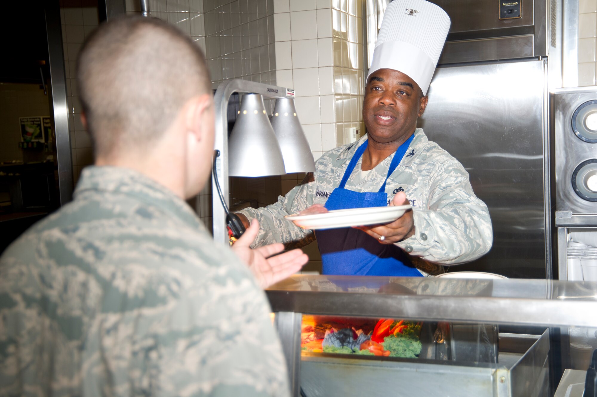 Col. Mark Vivians, 81st Mission Support Group commander, serves roast beef to Airmen at the Azalea Dining Facility during lunch on Thanksgiving Day Nov. 22, 2012, Keesler Air Force Base, Miss.  It is traditional at Keesler for commanders, first sergeants and superintendents to take time out of their holiday to serve a Thanksgiving meal at the dining facilities to their Airmen.  (U.S. Air Force photo by Adam Bond)