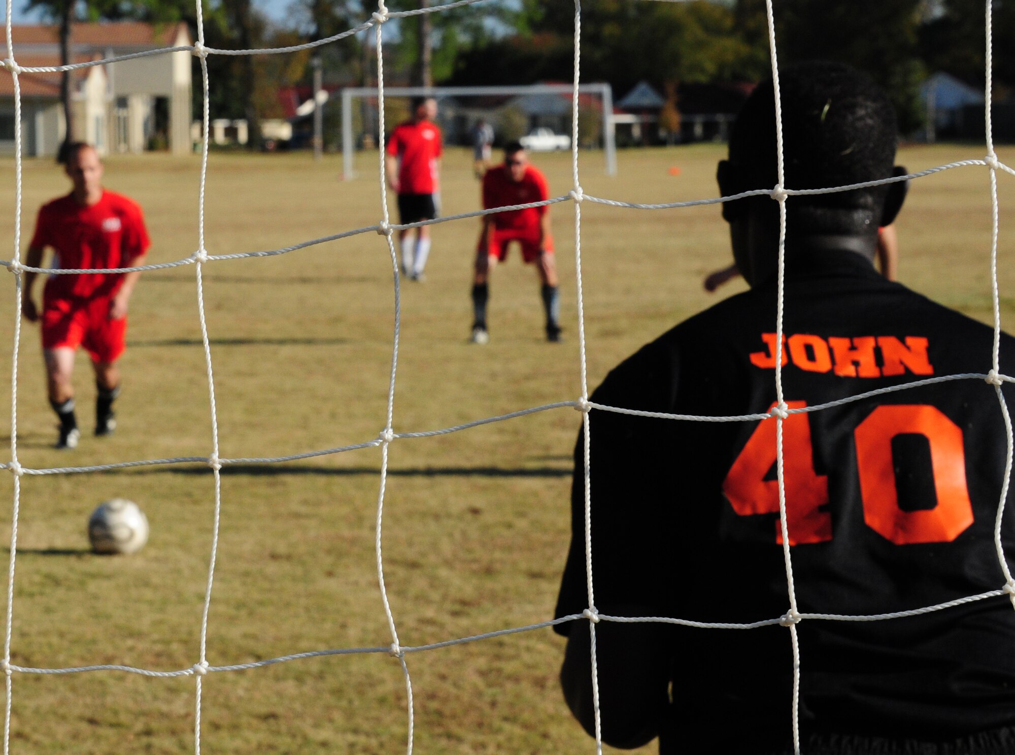 Squadron Officer School instructor Brent Hassler prepares to take a penalty kick as International Officer School student Jean Kaylnamura defends during a friendly match of soccer on Nov. 16. In the end, IOS proved too much for SOS as they won with a score of 6-2. (U.S. Air Force photo by Senior Airman Christopher Stoltz)