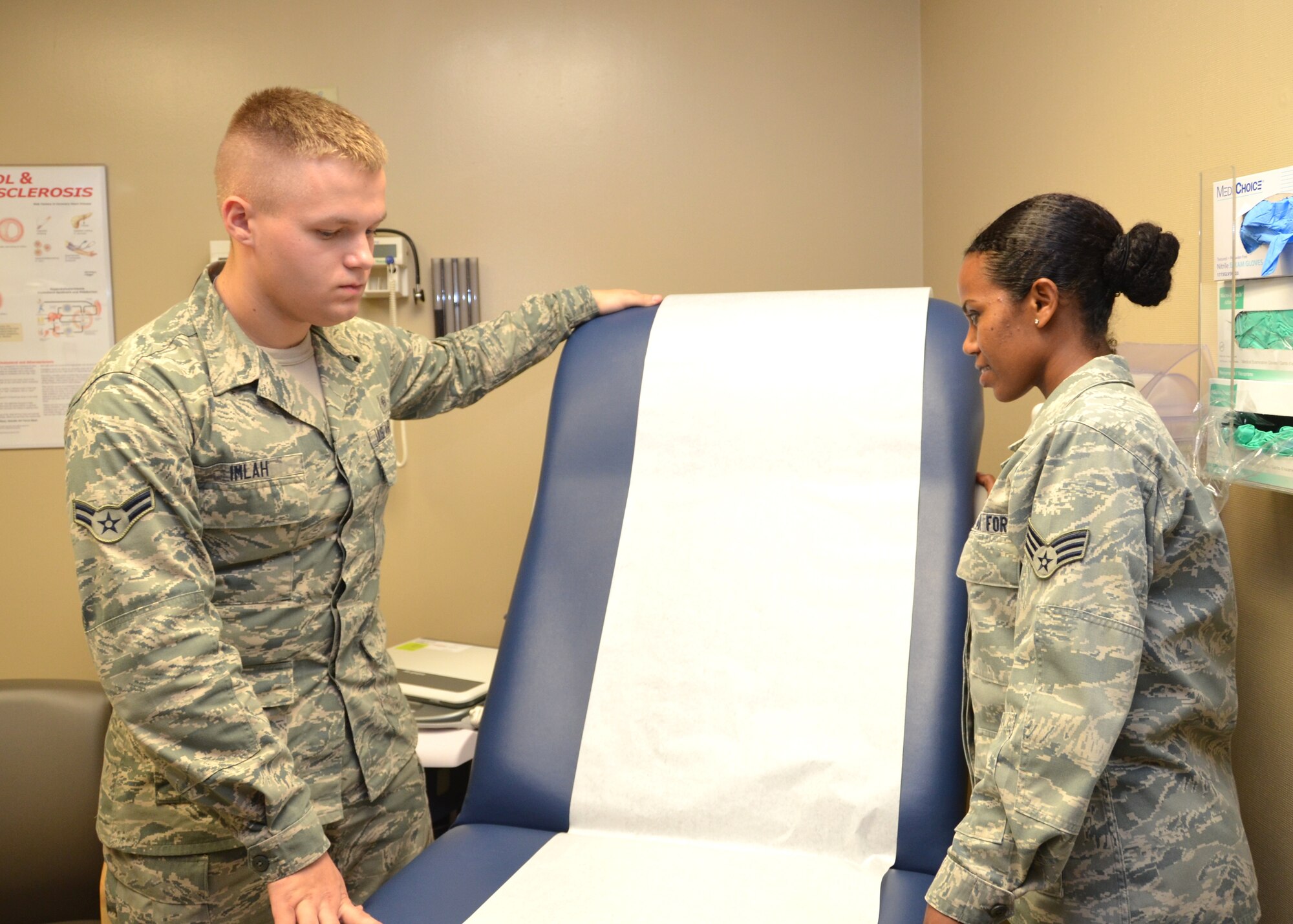 Airman 1st Class Mitchell Imlah and Senior Airman Tigist Belema, 81st Medical Operations Squadron, prepare a treatment room for a patient Nov. 7, 2012, at the Keesler Hospital, Keesler Air Force Base, Miss. Imalah recently arrived at Keesler, his first duty station, after losing more than 100 pounds to join the Air Force.  (U.S. Air Force photo by Steve Pivnick)