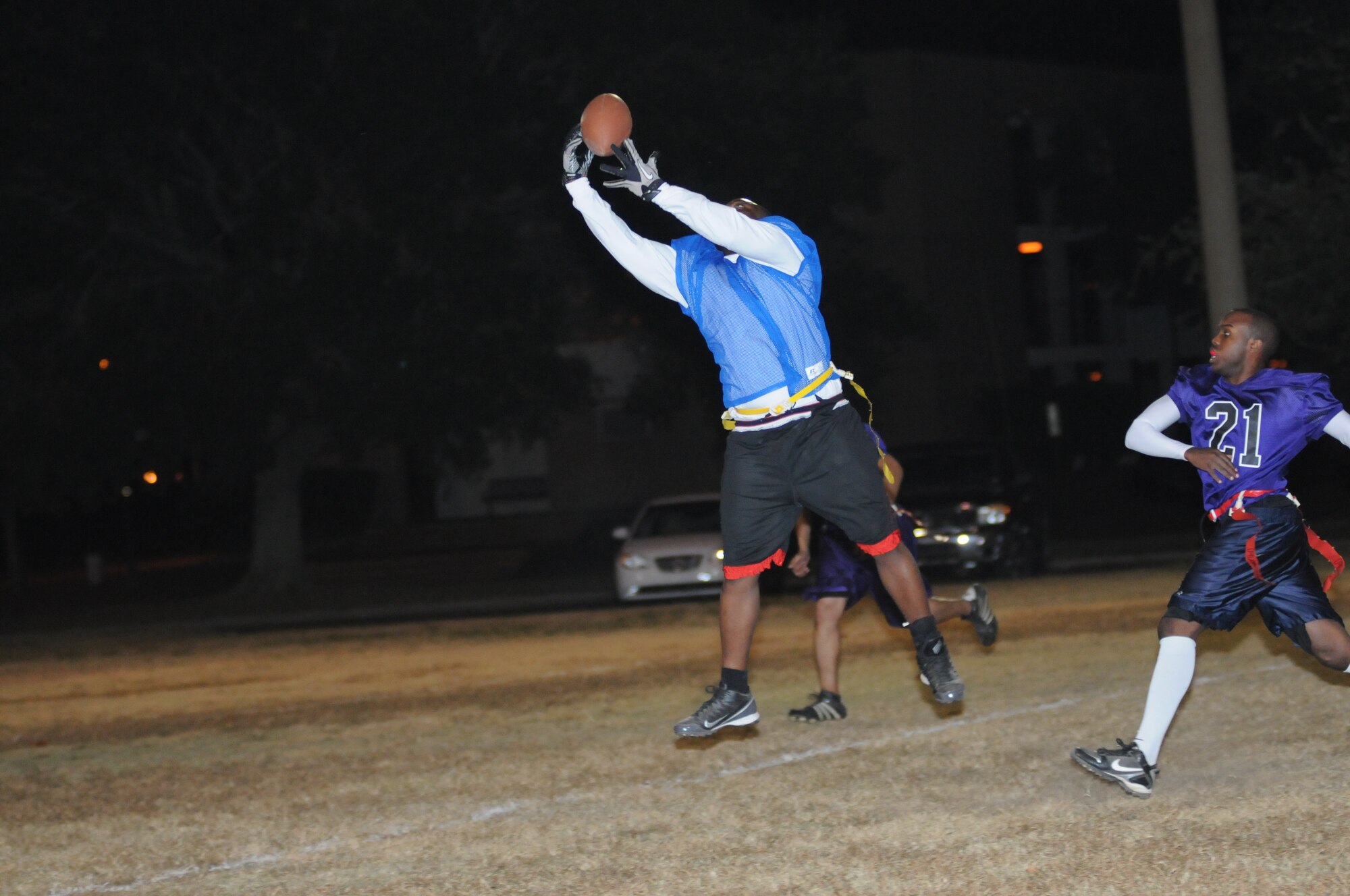 Brandon Jackson, 334th Training Squadron, leaps in the air for a touchdown pass during the intramural flag football championship game against the 403rd Wing Nov. 26, 2012, Keesler Air Force Base, Miss.  The 334th TRS defeated the 403rd, 28-26.  (U.S. Air Force photo by Kemberly Groue)