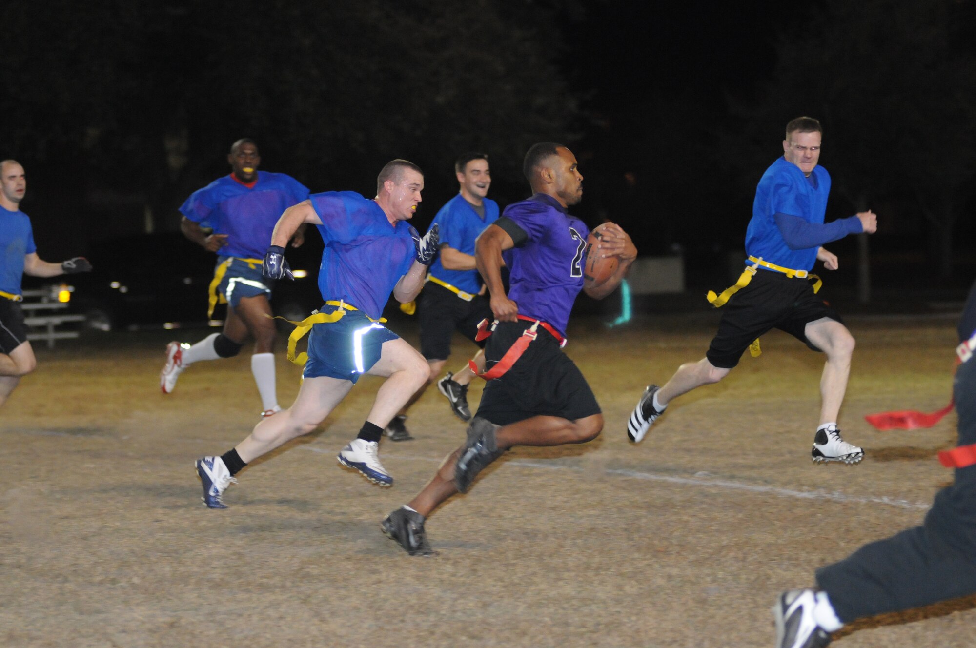 Rodney Watson, 403rd Wing, sprints down the field for a touchdown as 334th Training Squadron defenders attempt to stop him during the intramural flag football championship game Nov. 26, 2012, Keesler Air Force Base, Miss.  The 334th TRS defeated the 403rd, 28-26.  (U.S. Air Force photo by Kemberly Groue)