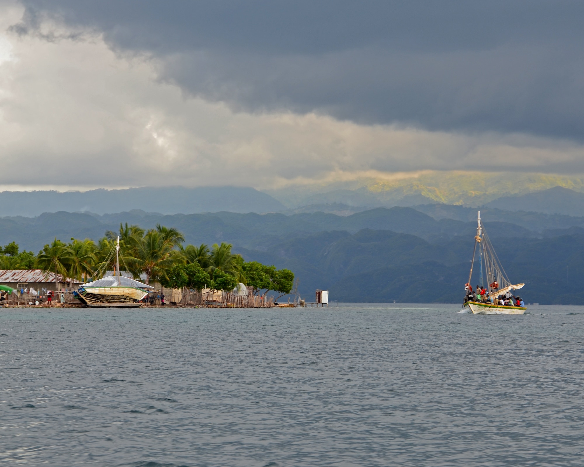 A boat full of travelers navigates the water around Grande Cayemite island, Haiti. Nearly three years after the devastating earthquake – and the Operation Unified Response relief effort, which the 439th Airlift Wing joined – Haiti shows signs of recovery. (U.S. Air Force photo by Lt. Col. James Bishop)