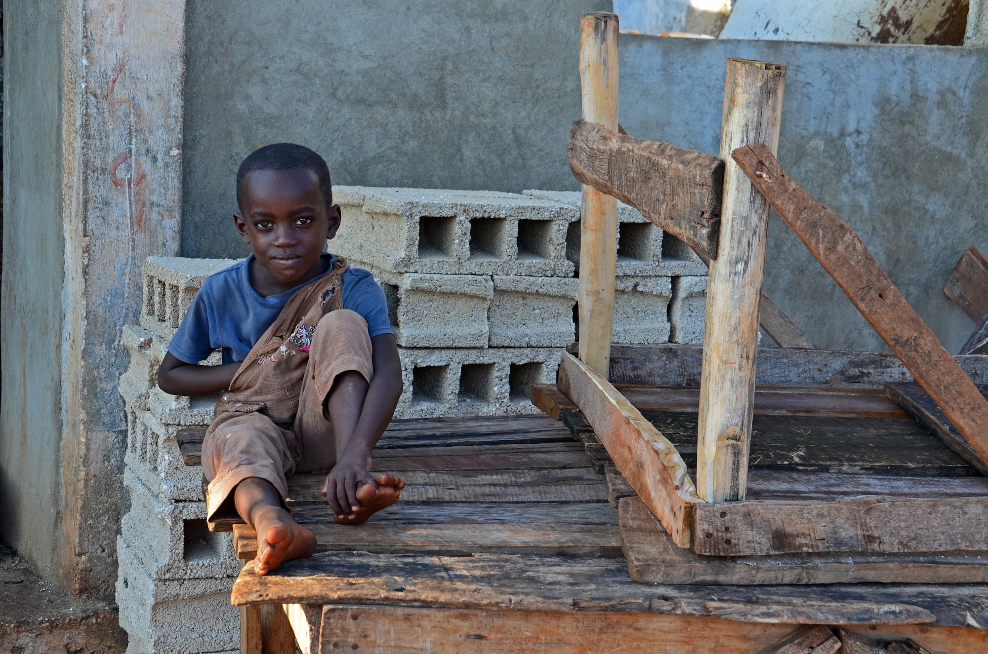 In the marketplace in Pestel, Haiti, a young boy watches the activity. Nearly three years after the lethal earthquake – and the worldwide relief effort, which the 439th Airlift Wing joined – Haiti shows signs of recovery. (U.S. Air Force photo by Lt. Col. James Bishop)