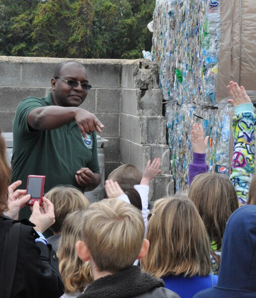 Edwin Wallace, 325th Civil Engineer Squadron solid waste and recycling, hazardous materials program manager, talked to students from Lynn Haven Elementary about how the facility recycles plastics during the student's tour of the recycling center Nov. 15. (U.S. Air Force photo by Senior Airman Christopher Reel)