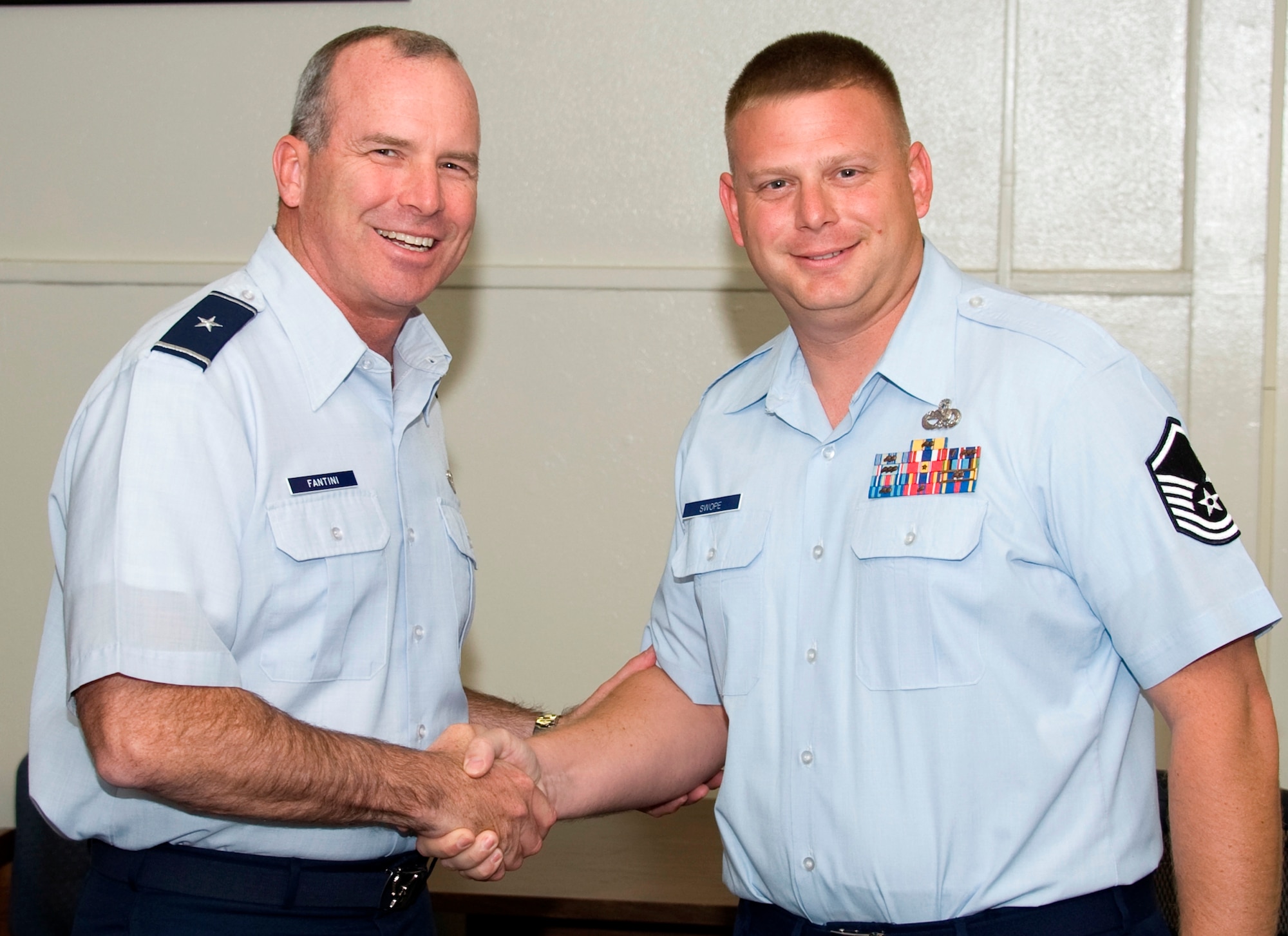 Brig. Gen. Michael Fantini (left), 82nd Training Wing commander, congratulates Master Sgt. Mark Swope, 373rd Training Squadron, for being named the "Commander's Wingman of Choice" for Nov. 26-30.  Swope is the HH-60/CV-22 training manager. (U.S. Air Force photo/Danny Webb)