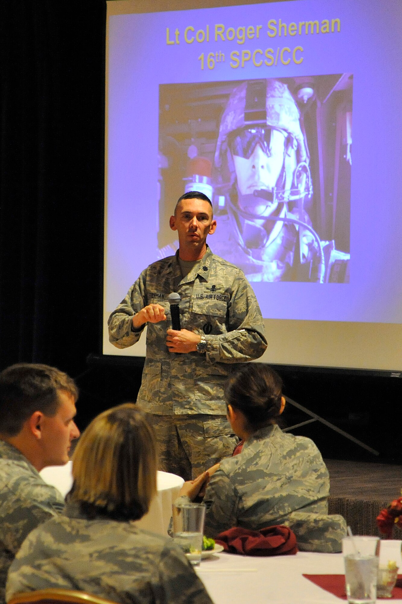 Lt. Col. Roger Sherman, 16th Space Control Squadron commander, shares his warrior stories Nov. 9 at The Club. Sherman deployed to Iraq as an electronic warfare officer with the Army in 2007. (U.S. Air Force photo/Dennis Howk)