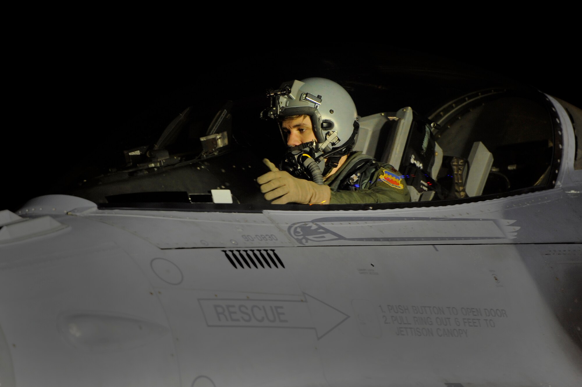 A U.S. Air Force F-16 Fighting Falcon pilot looks over the instruments in the cockpit during a hot pit refuel, Nov. 8, 2012, Shaw Air Force Base, S.C. Hot pit refueling is a procedure usually performed in a combat situation to rapidly refuel aircraft while their engines are running, resulting in a speedy refuel to thrust pilots right back into the fight. Refueling specialists, crew chiefs and pilots assigned to the 20th Fighter Wing practice this procedure to keep their skills sharp and aid in the effort to provide combat-ready air power at a moment’s notice. (U.S. Air Force photo by Staff Sgt. Kenny Holston/Released)