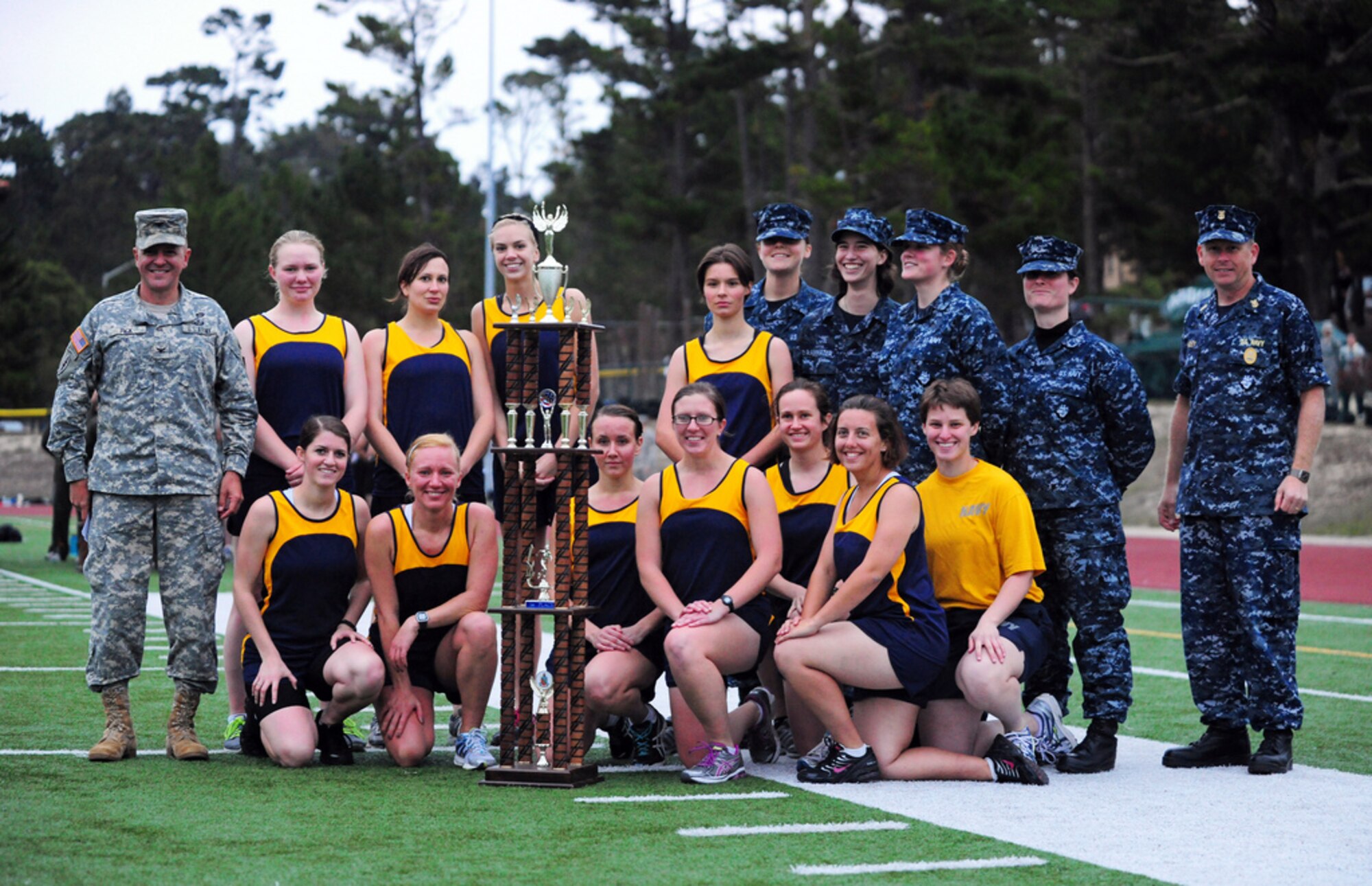 PRESIDIO OF MONTEREY, Calif. - The Defense Language Institute Foreign Language Center's quarterly Commander's Cup running competition was held at the Price Fitness Center track, Nov. 7. In the women's division the Navy seized first place with Marine Corps placing second. In the men's division the results were reversed as the Marine Corps placed first and the Navy second. The Marine Corps had the best combined time and was presented with the Commander's Cup trophy by DLIFLC Commandant Col. Danial Pick. (Courtesy photo)

