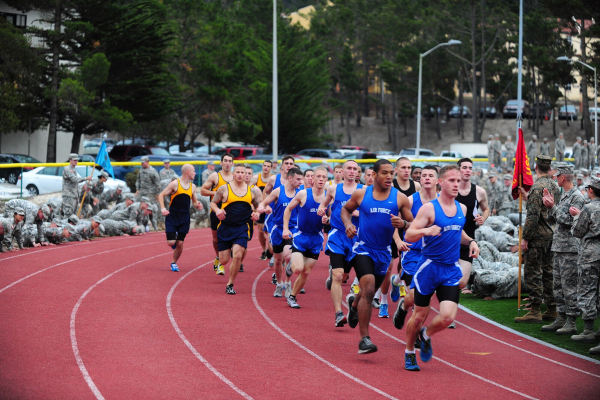 PRESIDIO OF MONTEREY, Calif. - The Defense Language Institute Foreign Language Center's quarterly Commander's Cup running competition was held at the Price Fitness Center track, Nov. 7. In the women's division the Navy seized first place with Marine Corps placing second. In the men's division the results were reversed as the Marine Corps placed first and the Navy second. The Marine Corps had the best combined time and was presented with the Commander's Cup trophy by DLIFLC Commandant Col. Danial Pick. (Courtesy photo)



