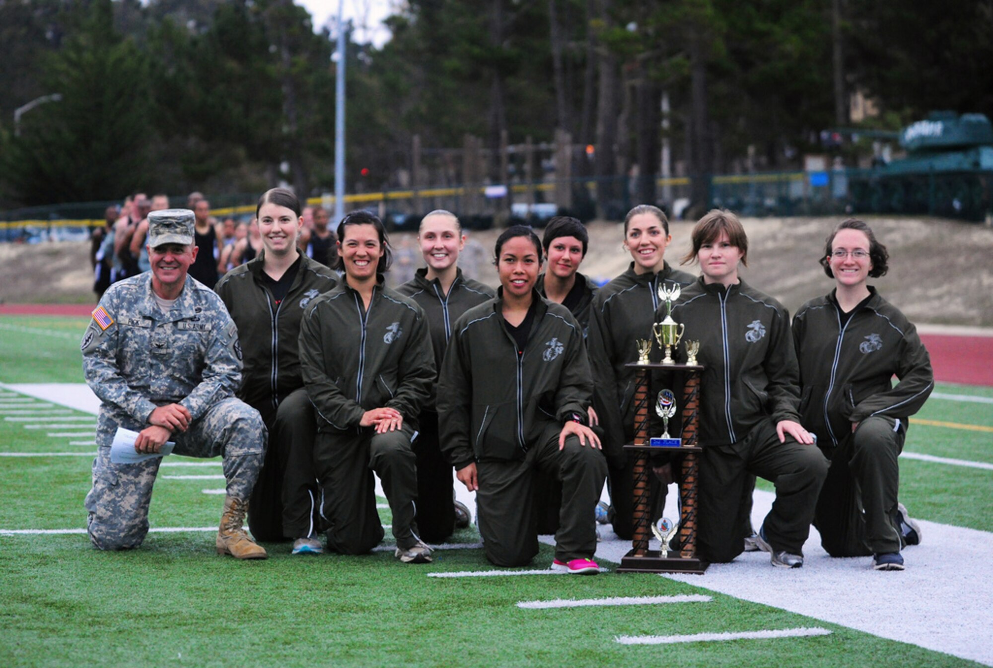 PRESIDIO OF MONTEREY, Calif. - The Defense Language Institute Foreign Language Center's quarterly Commander's Cup running competition was held at the Price Fitness Center track, Nov. 7. In the women's division the Navy seized first place with Marine Corps placing second. In the men's division the results were reversed as the Marine Corps placed first and the Navy second. The Marine Corps had the best combined time and was presented with the Commander's Cup trophy by DLIFLC Commandant Col. Danial Pick. (Courtesy photo)



