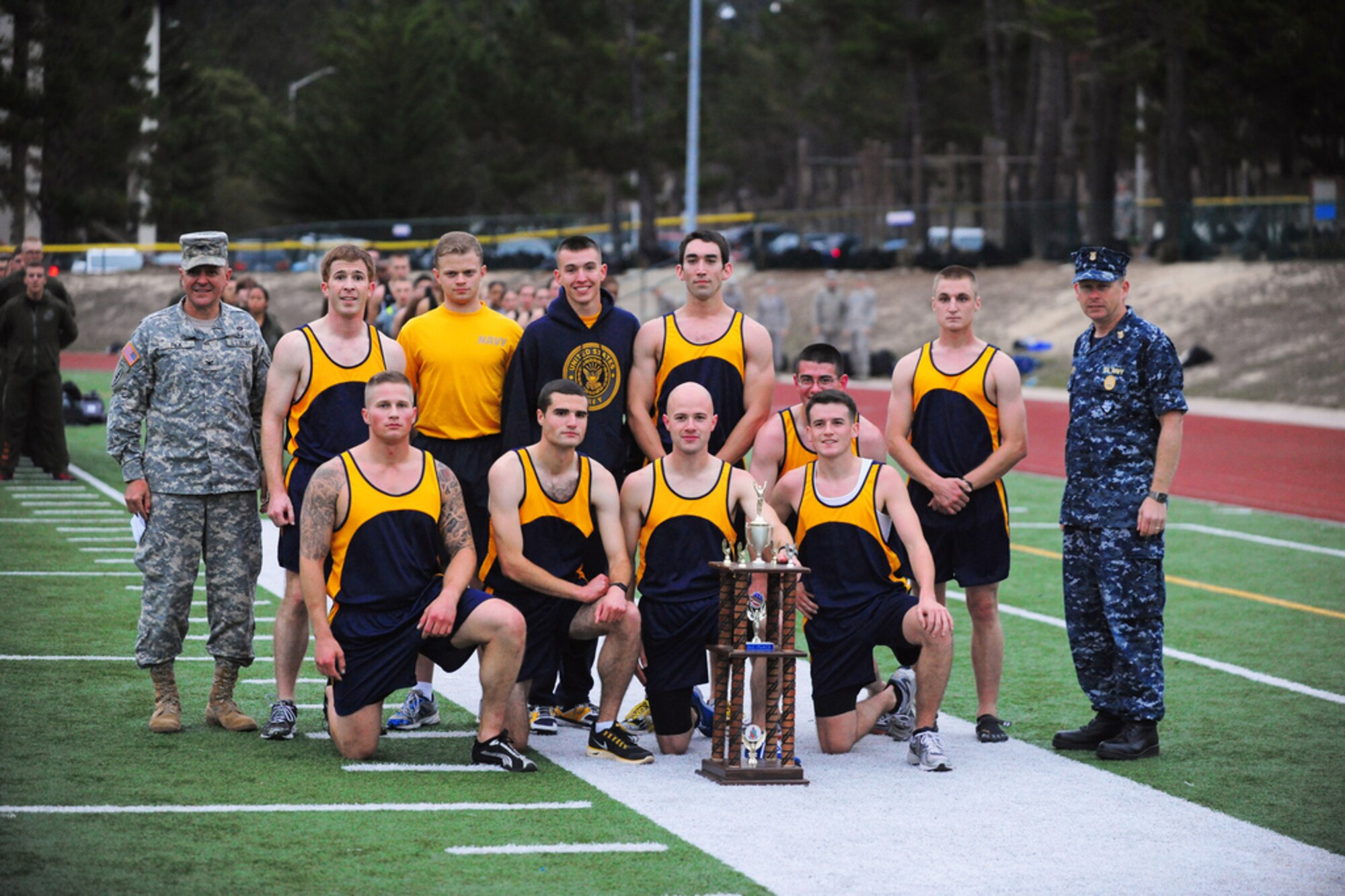 PRESIDIO OF MONTEREY, Calif. - The Defense Language Institute Foreign Language Center's quarterly Commander's Cup running competition was held at the Price Fitness Center track, Nov. 7. In the women's division the Navy seized first place with Marine Corps placing second. In the men's division the results were reversed as the Marine Corps placed first and the Navy second. The Marine Corps had the best combined time and was presented with the Commander's Cup trophy by DLIFLC Commandant Col. Danial Pick. (Courtesy photo)



