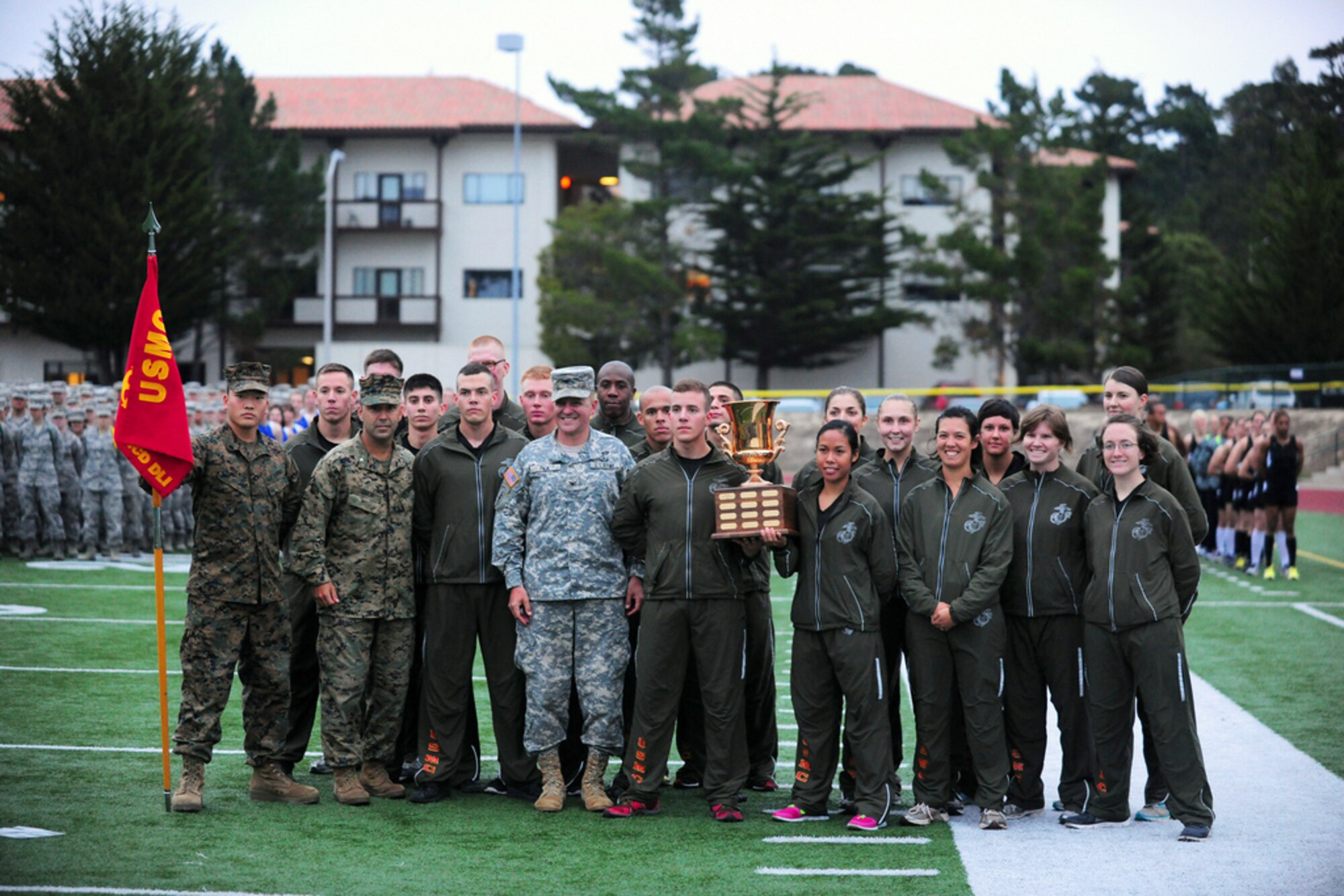 PRESIDIO OF MONTEREY, Calif. - The Defense Language Institute Foreign Language Center's quarterly Commander's Cup running competition was held at the Price Fitness Center track, Nov. 7. In the women's division the Navy seized first place with Marine Corps placing second. In the men's division the results were reversed as the Marine Corps placed first and the Navy second. The Marine Corps had the best combined time and was presented with the Commander's Cup trophy by DLIFLC Commandant Col. Danial Pick. (Courtesy photo)



