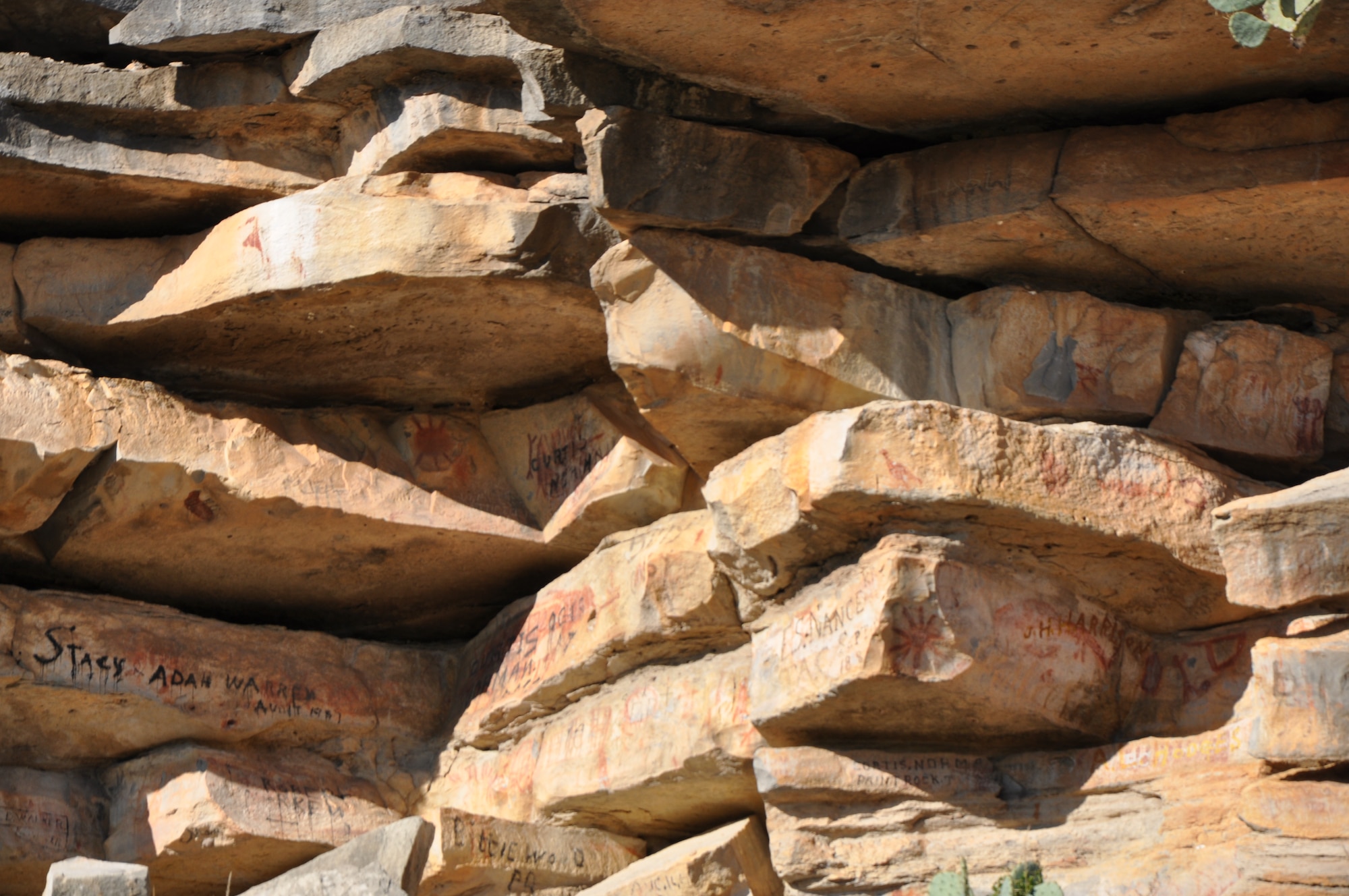 PAINT ROCK, Texas – The words in black are considered graffiti and is part of the tour at Paint Rock Nov. 24. The property containing Painted Rock was bought more than a hundred years ago to prevent people from defacing the rock with more graffiti. (U.S. Air Force Photo/ Airman 1st Class Joshua Edwards)