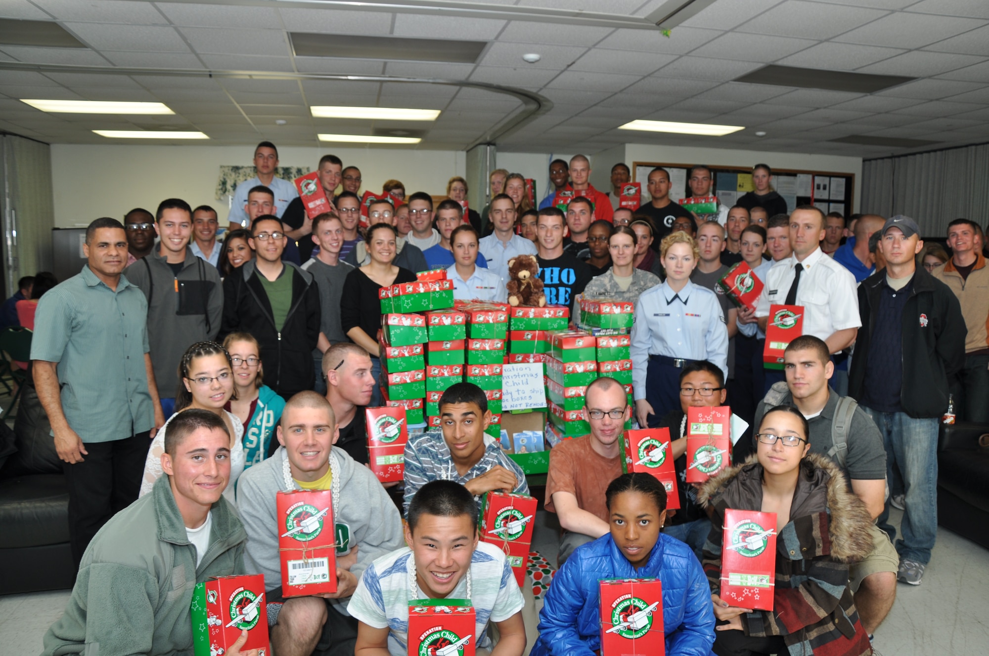 GOODFELLOW AIR FORCE BASE, Texas – Capt. Victor Pagan and Chapel Student Leaders pose with the Operation Christmas Child boxes at Crossroads here Nov. 18. This group was able to collect over a hundred boxes for Operation Christmas Child. (U.S. Air Force photo/ Airman 1st Class Joshua Edwards)