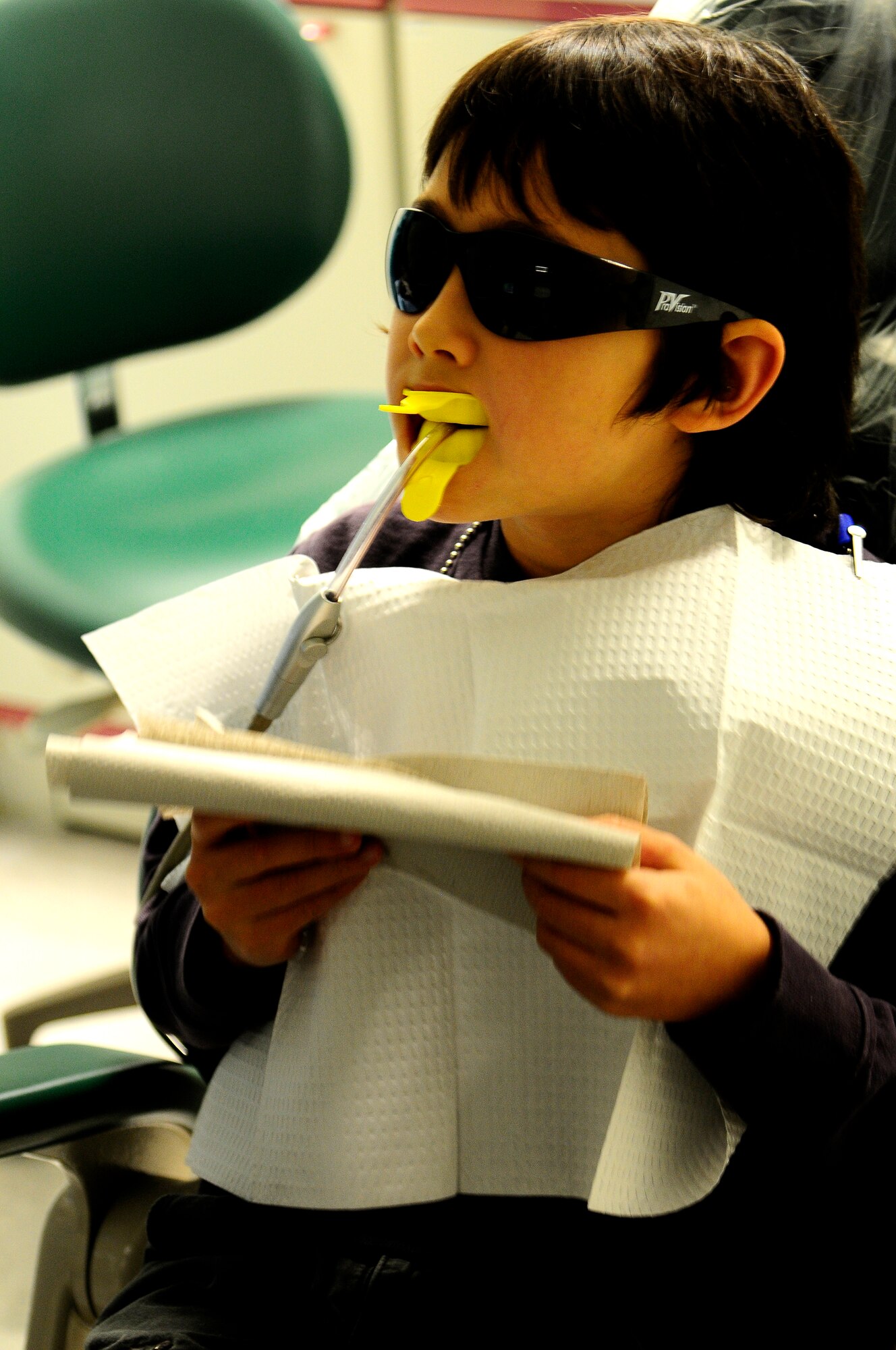 Kai Kramer, son of Master Sgt. Randall Kramer, 86th Medical Support Squadron, receives a fluoride treatment during his visit to the dentist during the Little Teeth Big Smiles event on Ramstein Air Base, Germany Nov. 17, 2012. Little Teeth Big Smiles was started to ensure children are kept up to date with their X-rays and teeth cleaning. (U.S. Air Force photo/Airman 1st Class Hailey Haux)