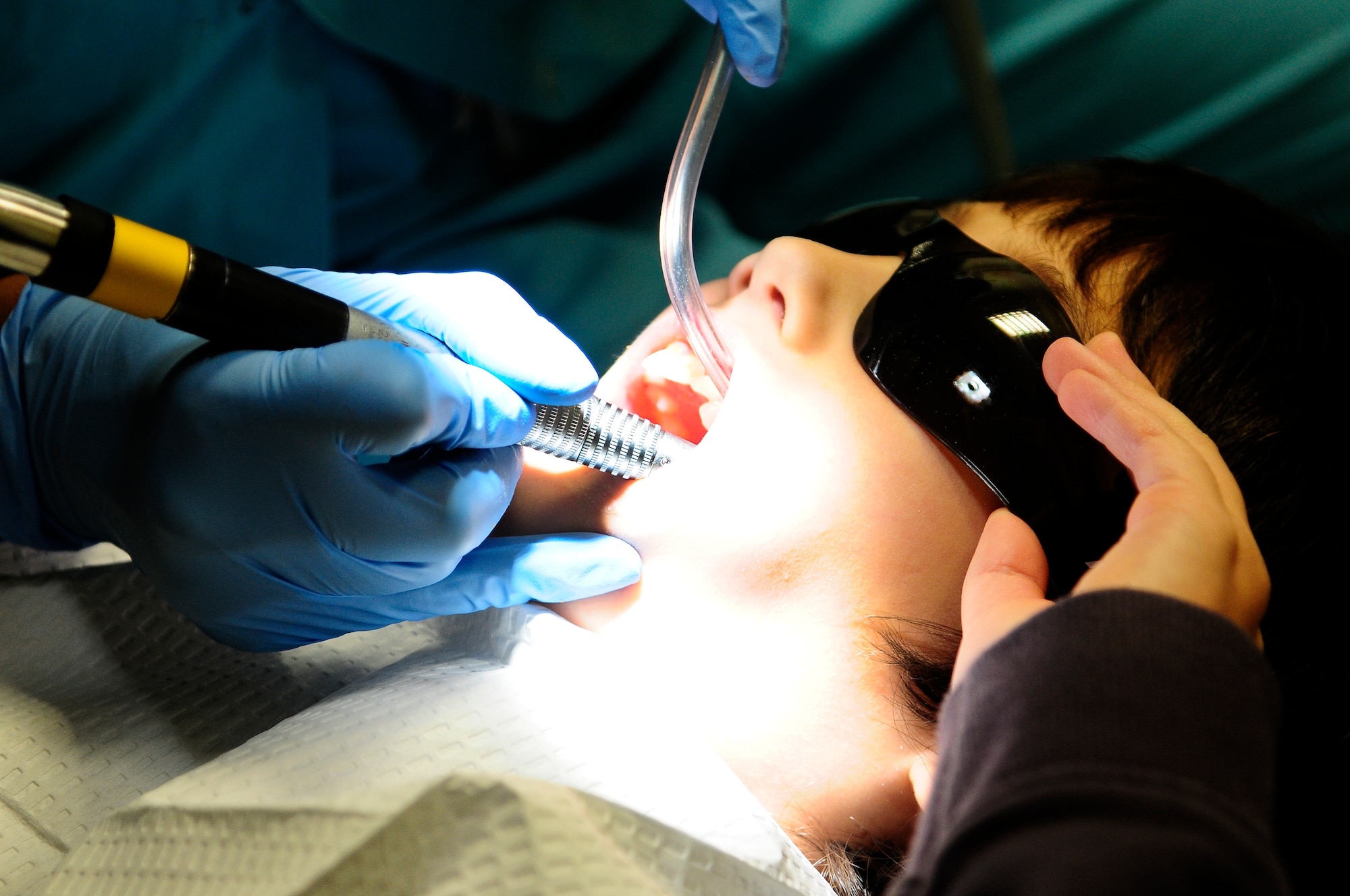 Kai Kramer, son of Master Sgt. Randall Kramer, 86th Medical Support Squadron, gets his teeth cleaned during his visit to the dentist during the Little Teeth Big Smiles event on Ramstein Air Base, Germany Nov. 17, 2012. Little Teeth Big Smiles was started to ensure children are kept up to date with their X-rays and teeth cleaning. (U.S. Air Force photo/Airman 1st Class Hailey Haux)