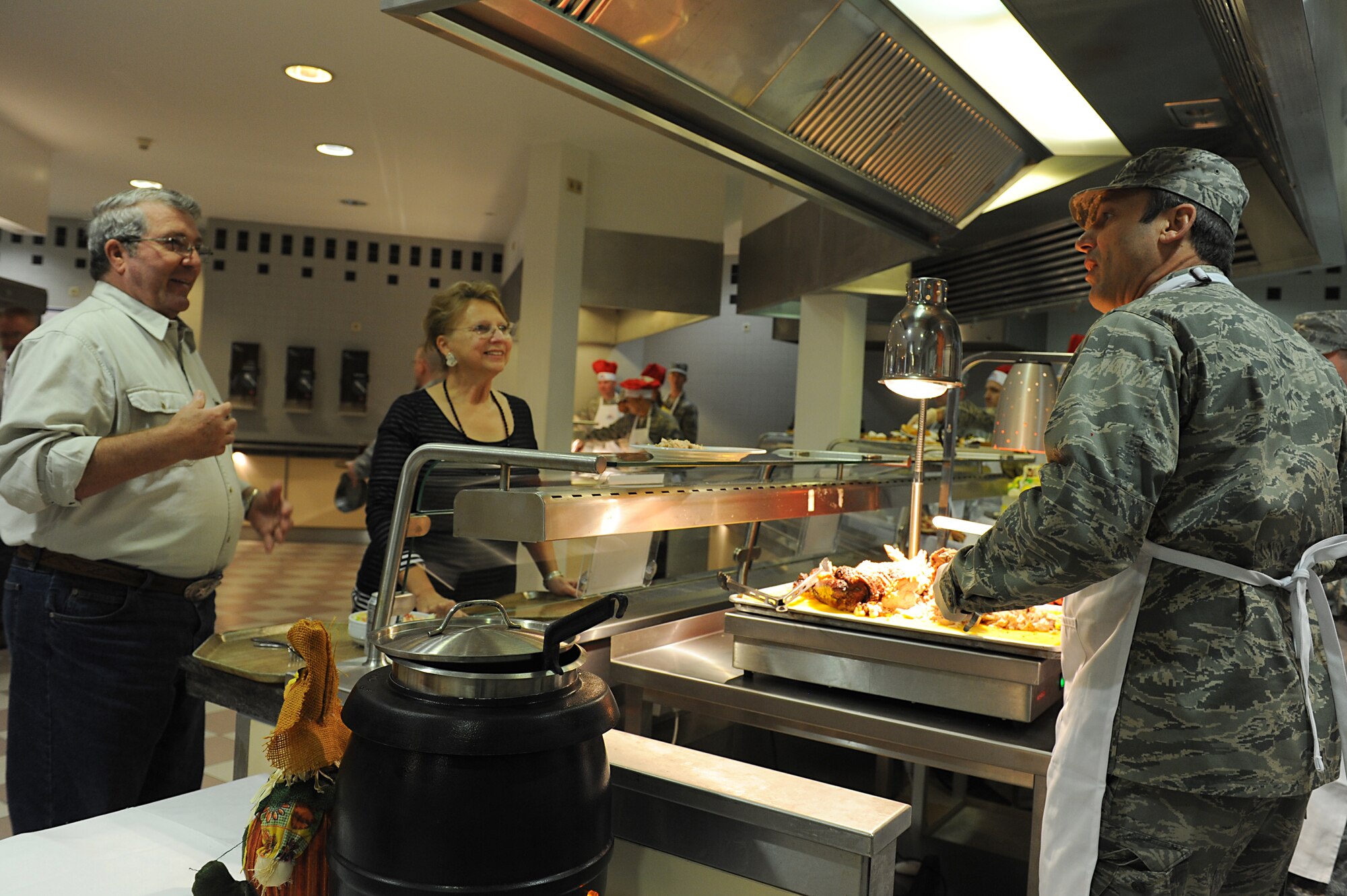 Lt. Gen. Noel T. Jones, U.S. Air Forces in Europe and Air Forces Africa vice
commander, carves turkey for Airmen and their families on
Thanksgiving Day at the Rheinland Inn Dining Facility on Ramstein Air Base,
Germany, Nov. 22, 2012. The dining facility along with many base leadership
volunteers and their families served up a taste of home for KMC Airmen and
their families. (U.S. Air Force photo/Airmen 1st Class Holly Cook)