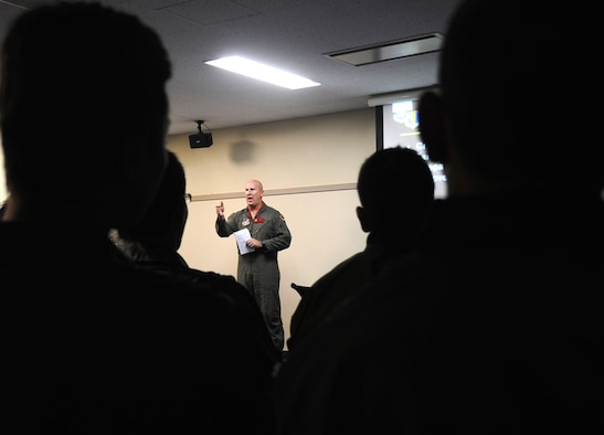 U.S. Air Force Lt. Col. Scott Fredrick, 13th Fighter Squadron director of operations, de-briefs pilots and exercise support staff during Keen Sword 2013 at Misawa Air Base, Japan, Nov. 8, 2012. During the briefing, pilots went over simulated battle plans and field training  events. (U.S. Air Force photo by Airman 1st Class Kenna Jackson)