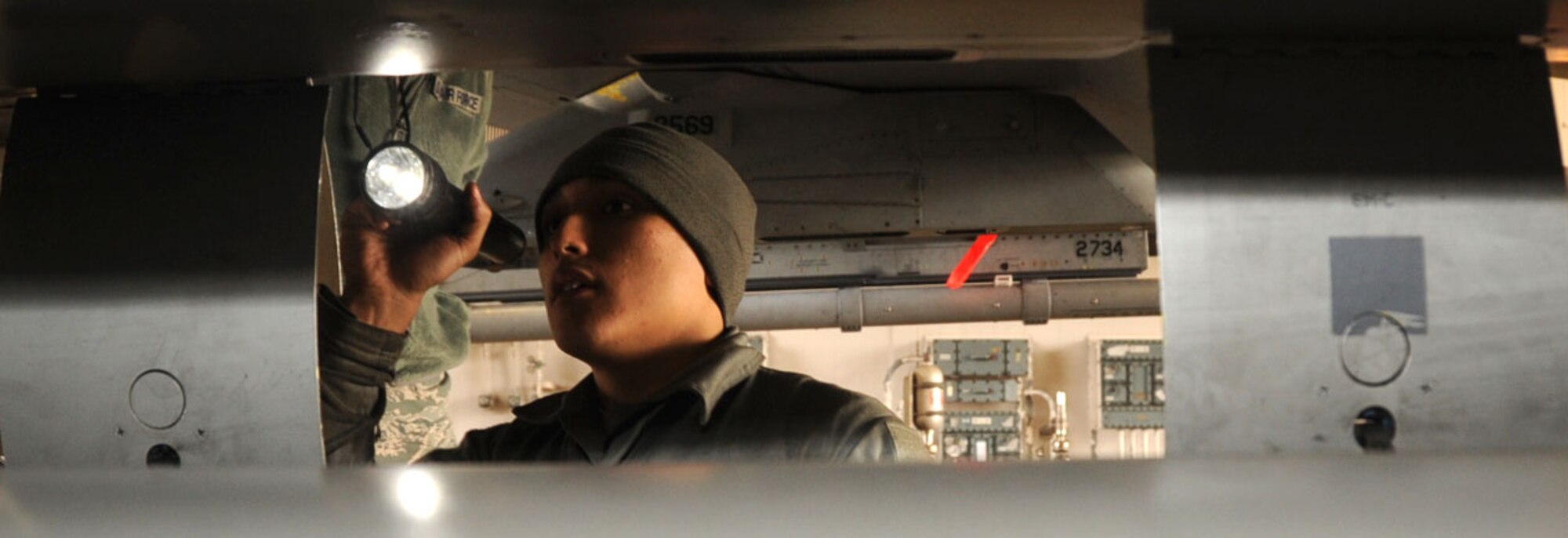 U.S. Air Force Airman 1st Class Geanny Bada, 14th Aircraft Maintenance Unit crew chief, performs an inspection on an F-16 Fighting Falcon aircraft during Keen Sword 2013 at Misawa Air Base, Japan, Nov. 8, 2012. Keen Sword is  a joint-bilateral field training exercise and involves approximately  10,000 U.S. particpants from the Army, Navy, Air Force and Marines. (U.S. Air Force photo by Airman 1st Class Kenna Jackson)