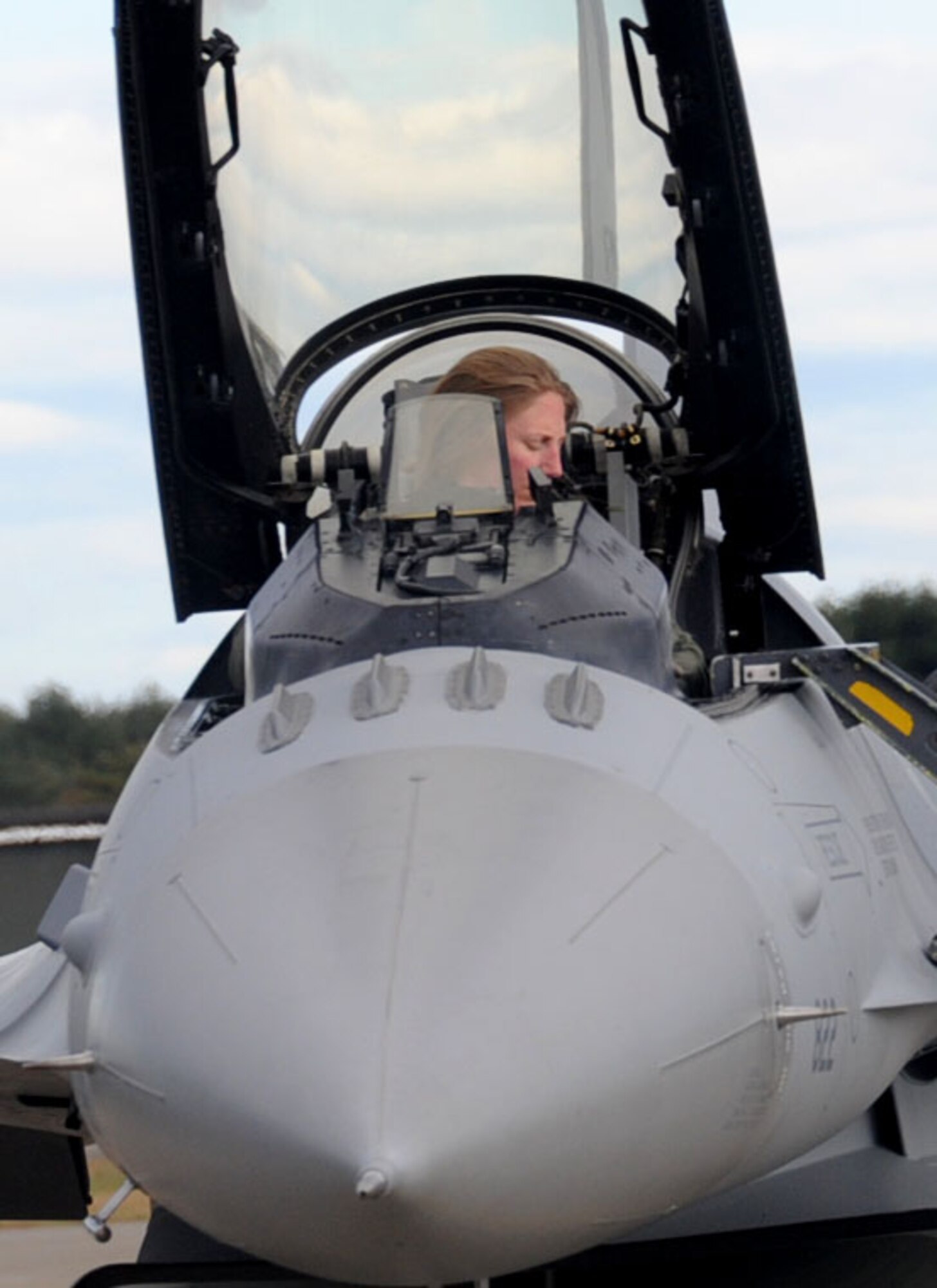 U.S. Air Force Maj. Kathryn Gaetke, 14th Fighter Squadron pilot, prepares to exit her F-16 Fighting Falcon aircraft after completing a mission during Keen Sword 2013 at Misawa Air Base, Japan, Nov. 8, 2012. Gaetke was one of the first pilots to land after completing a simulated mission objective for the exercise. (U.S. Air Force photo by Airman 1st Class Kenna Jackson)