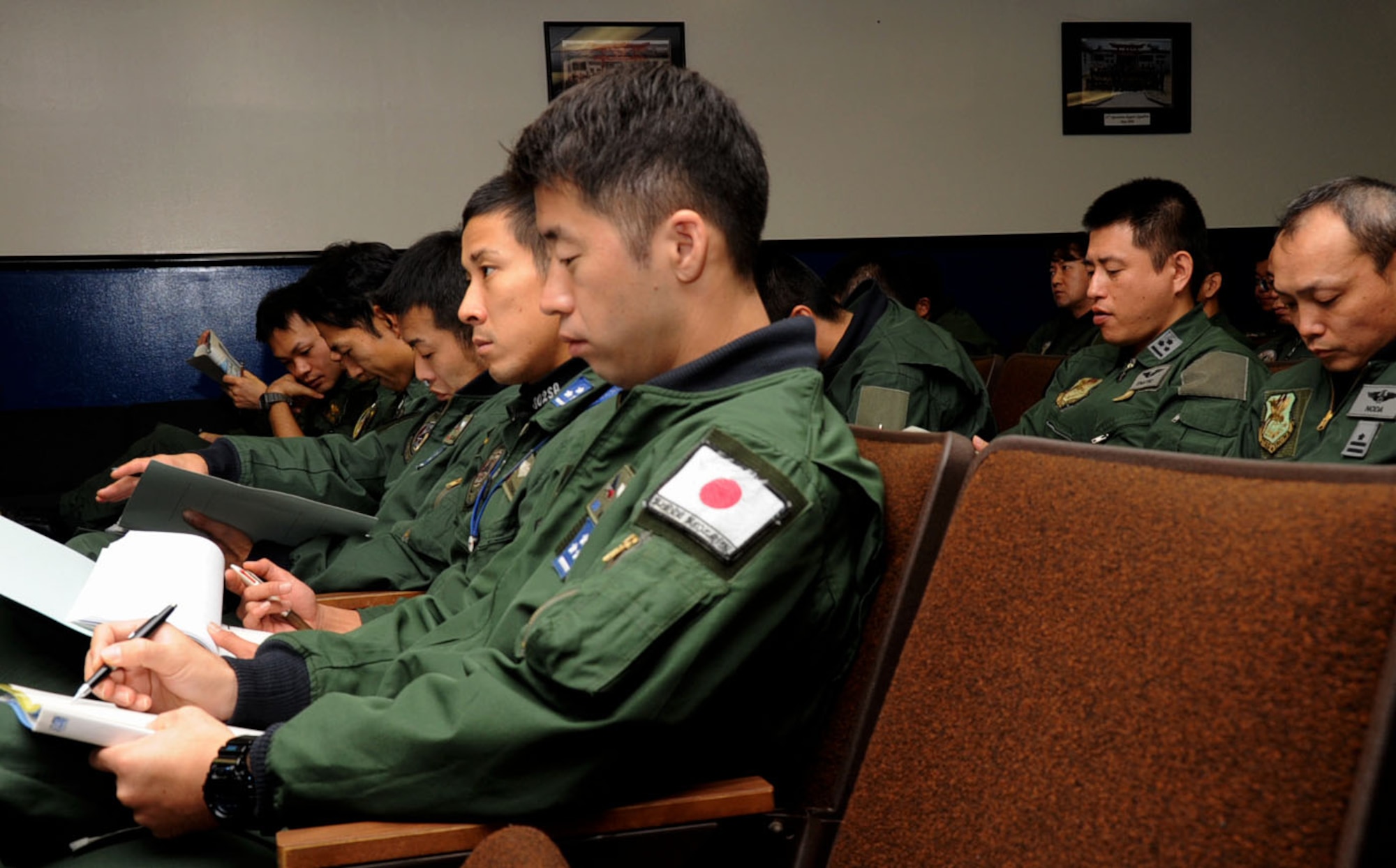 Members of the Japan Air Self-Defense Force listen during a Keen Sword 2013 initial briefing at Misawa Air Base, Japan, Nov. 7, 2012. At the briefing, pilots from the U.S. military and JASDF were told what the bilateral team would be doing during an upcoming mission. (U.S. Air Force photo by Airman 1st Class Kenna Jackson)