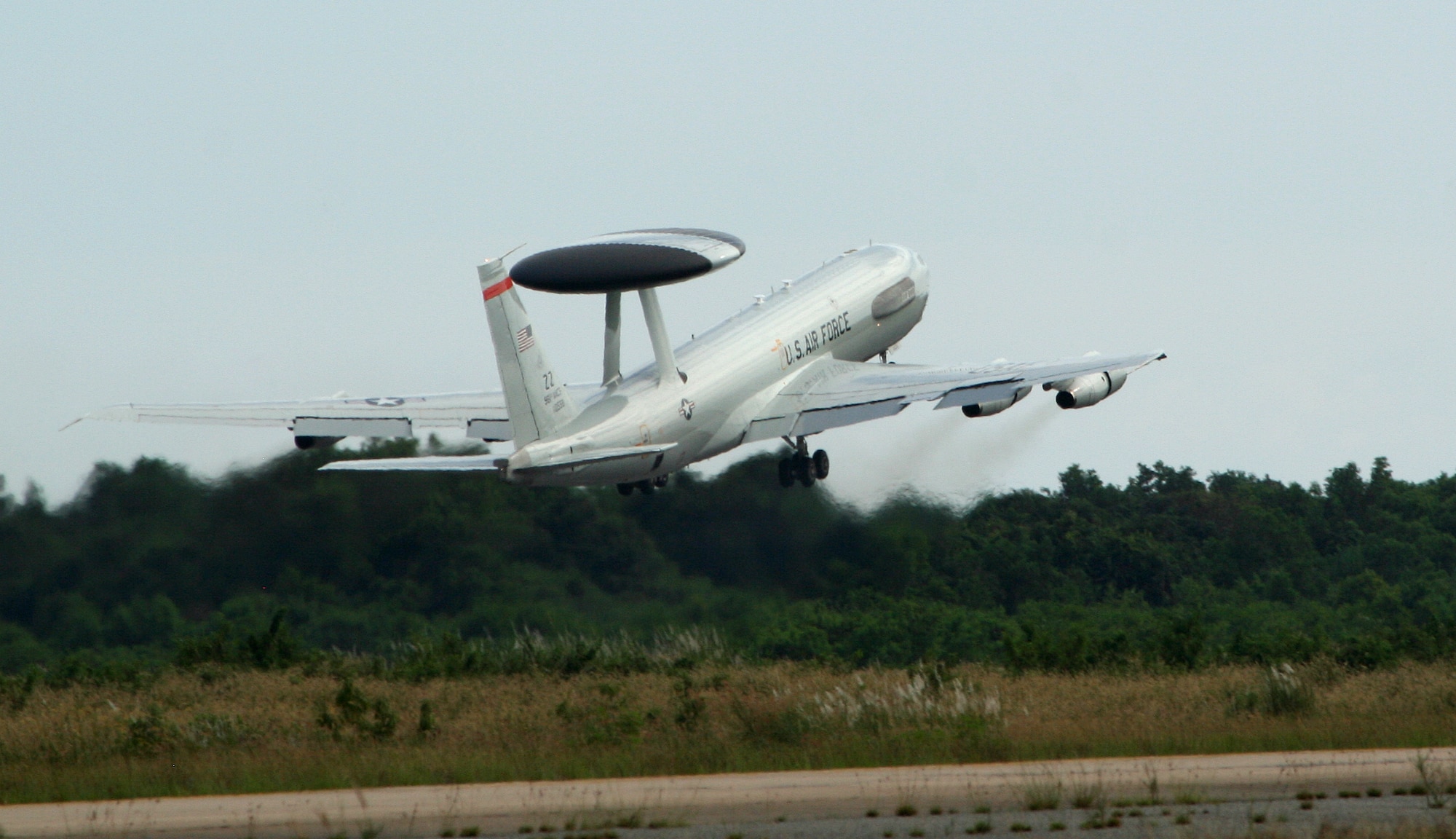 An E-3 Sentry aircraft deployed from Kadena Air Base, Japan, takes off from an airfield in Thailand, Nov. 20, while providing security support for a U.S. presidential visit to Southeast Asia. A total of four E-3s and 150 Airmen from the two bases provided air battle management support during President Barrack Obama's four-day visit to Thailand, Cambodia and Burma. (Courtesy photo)
