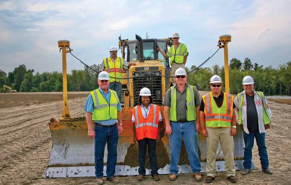 Pictured left to right, James Coffey, president, Harold Coffey Construction; Regina Kuykendoll Cash; Ben Coffey; Donny Davidson, Area Engineer, USACE Caruthersville Area Office; and Bobby Joe George. Second row is USACE Construction Inspector Bobby Carlyle, left, and Johnny Tindle, dozier operator, on right.