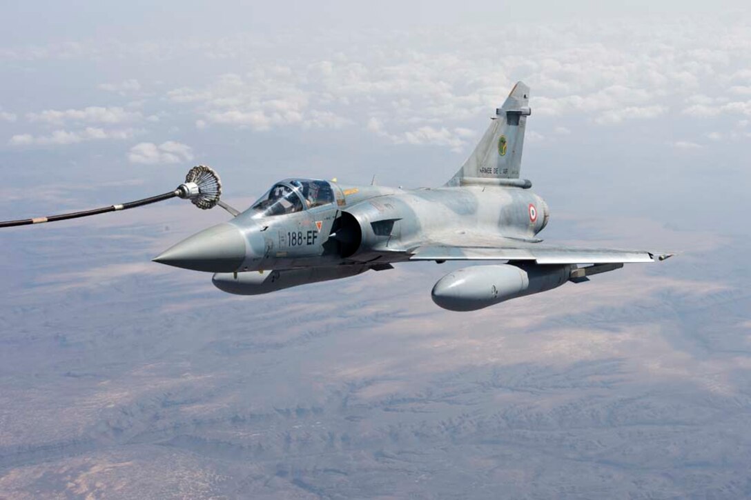 A KC-130J, assigned to the Marine Aerial Refueler Transport Squadron 352, refuels a Dassault Mirage 2000-5 assigned to French forces as part of a refueling training mission Nov. 22, 2012.  Coalition aerial refueling training helps develop French and U.S. forces' interoperability across a variety of critical mission areas and demonstrates the American and French militaries' continued commitment to the standards and values of the NATO Alliance. The 15th MEU is deployed as part of the Peleliu Amphibious Ready Group as a theater reserve and crisis response force in the U.S. 5th Fleet area of responsibility. (U.S. Air Force photo by Tech. Sgt. Joseph McKee)