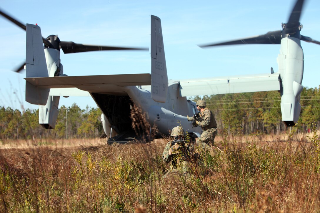 Marines with Special-Purpose Marine Air-Ground Task Force Africa 13.2 provide security after disembarking from an MV-22 Osprey during a field training exercise aboard Marine Corps Base Camp Lejeune, N.C., Nov. 16, 2012. Marines of Special-Purpose MAGTF Africa 13.2 are training for their upcoming deployment that begins in January and ends seven months later.  (Marine Corps photo by Lance Cpl. Caleb McDonald/Released)