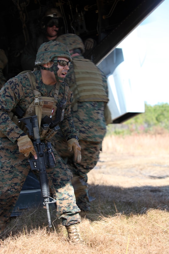 Staff Sgt. Ramon Aponte, a platoon sergeant with Special-Purpose Marine Air-Ground Task Force Africa takes accountability of his Marines as they board an MV-22 Osprey during a field training exercise aboard Marine Corps Base Camp Lejeune, N.C., Nov. 16, 2012. Marines of Special-Purpose MAGTF Africa 13.2 are training for their upcoming deployment.  (Marine Corps photo by Lance Cpl. Caleb McDonald/Released)