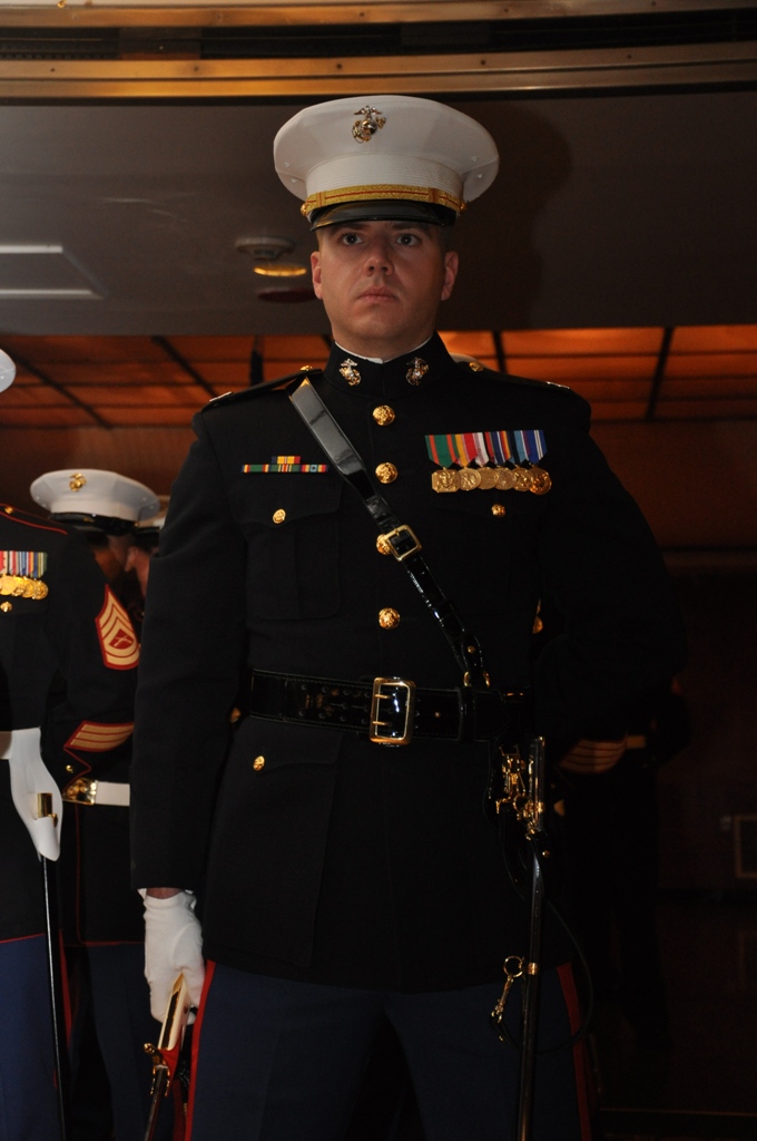 Captain Clinton Holbrook, commanding officer of Headquarters Battalion, Marine Corps Logistics Base Barstow, participates in the sword detail during the Marine Corps Birthday Ball aboard the Queen...
