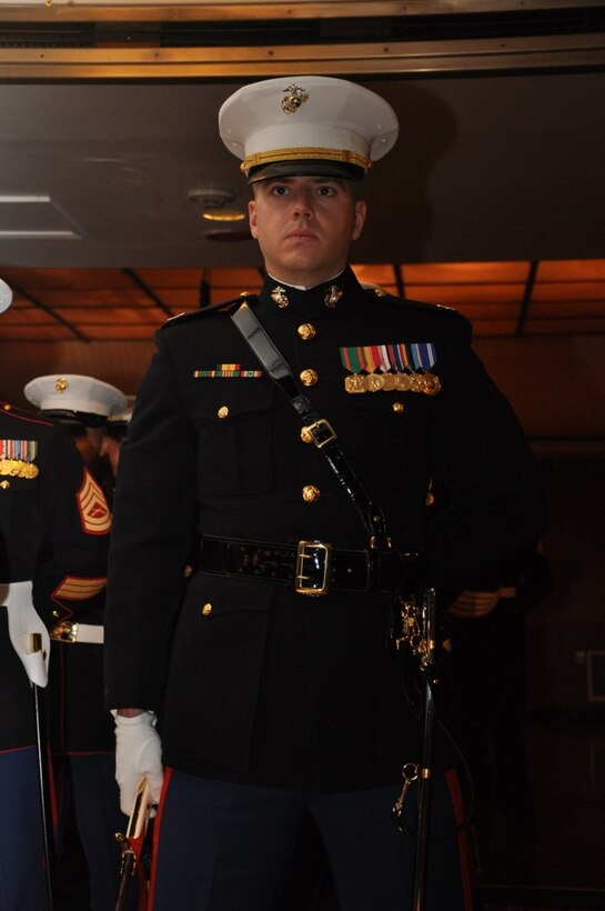 Captain Clinton Holbrook, commanding officer of Headquarters Battalion, Marine Corps Logistics Base Barstow, participates in the sword detail during the Marine Corps Birthday Ball aboard the Queen...
