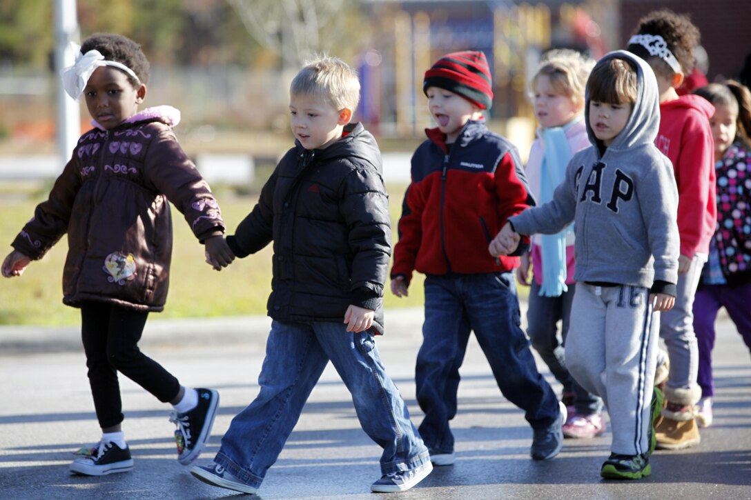 Students from Tarawa Terrace Elementary trot past as part of the annual Combined Federal Campaign walk aboard Marine Corps Base Camp Lejeune Nov. 16. The students raised more than $1,700 for the Wounded Warrior Family Support, Inc., exceeding their goal of just $1,000.