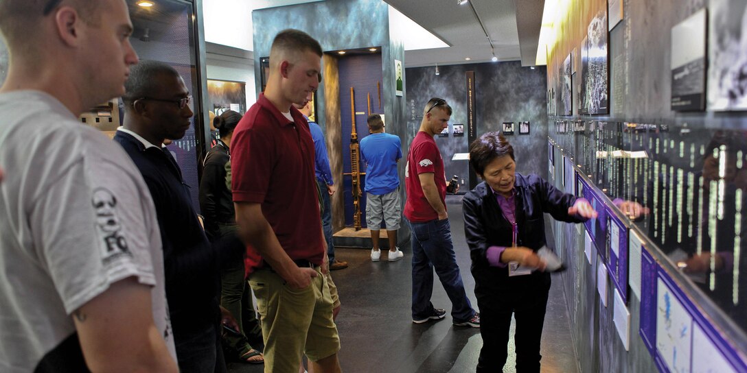 Setsuko Inafuku educates Marines on the Battle of Okinawa at the site of the former Japanese Navy Underground Headquarters during a battle sites tour Nov. 13. 